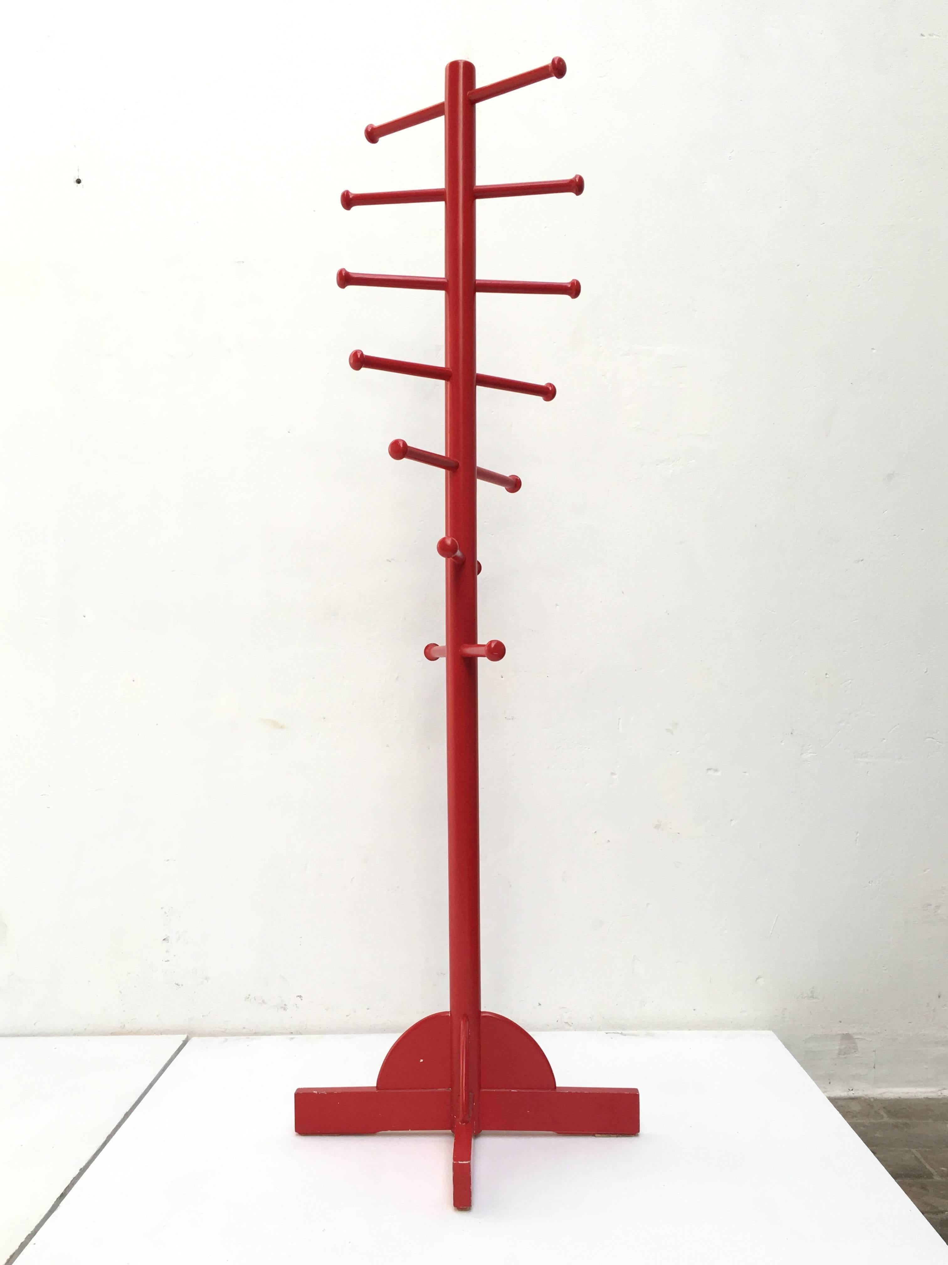 Lovely example of Sottsass' iconic coat stand finished in the original red lacquer over a cascading spiraling form wooden structure.

Sergio Cammilli's 'Poltronova' were at the forefront of cutting edge radical Italian design during this highly