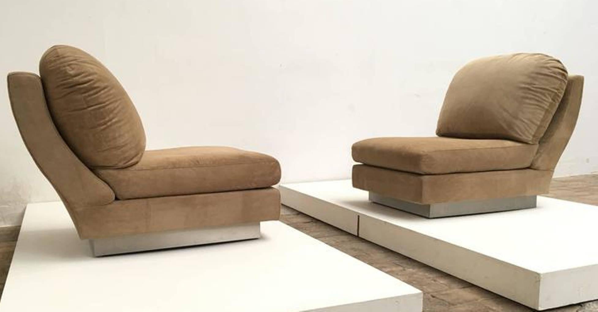 Extremely rare pair of signed Willy Rizzo lounge chairs finished in suede with stainless steel bases. 

These are very early examples which were produced by the 'Studio Willy Rizzo' in Rome in 1969, recognised by the Willy Rizzo signature in the