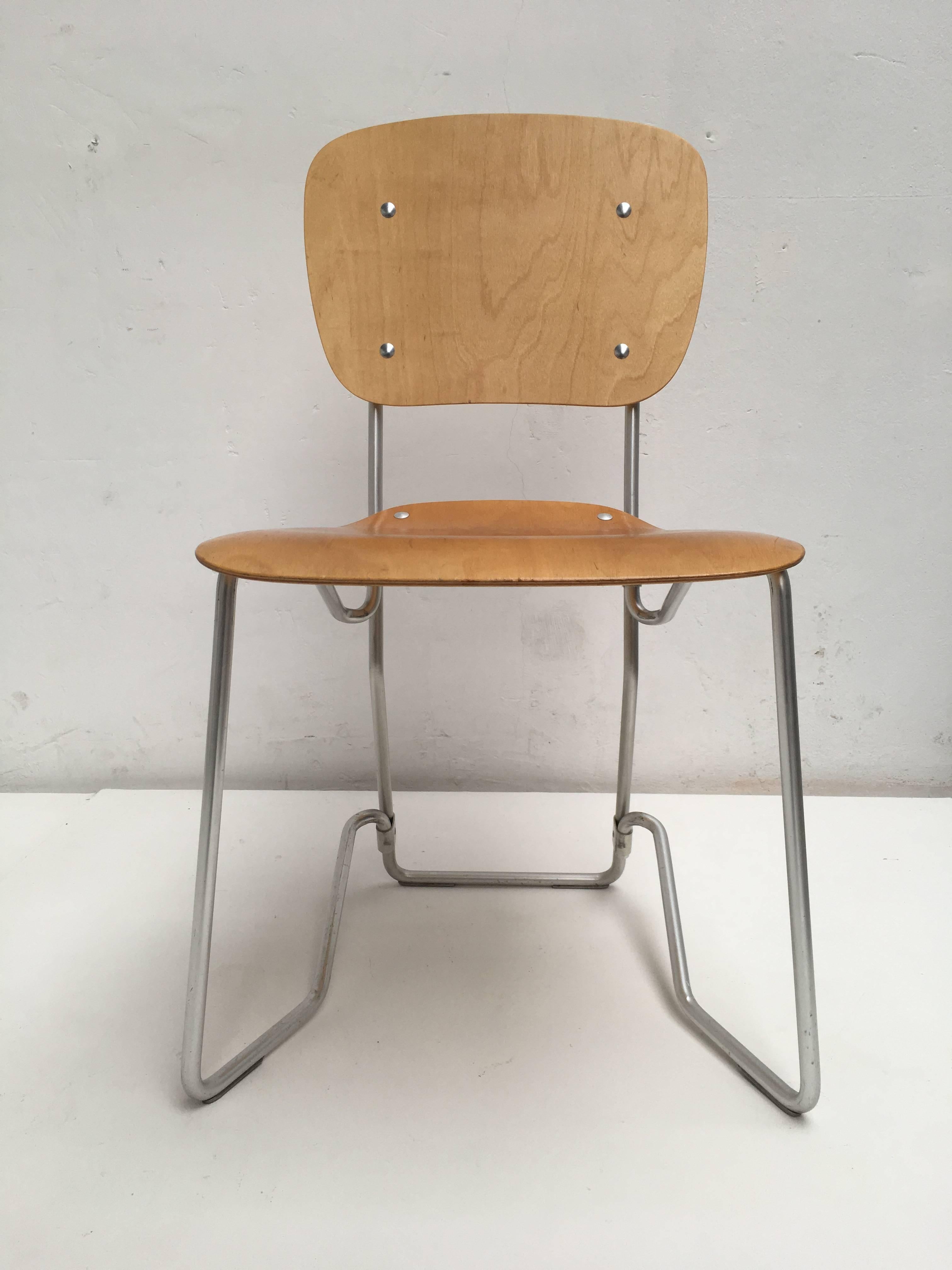 Large set of 12 Swiss "Aluflex" chairs by Armin Wirth and produced by Aluflex, Switzerland

This ingenious lightweight chair is made out of an aluminium frame and thin birch plywood seat and back and was originally designed in