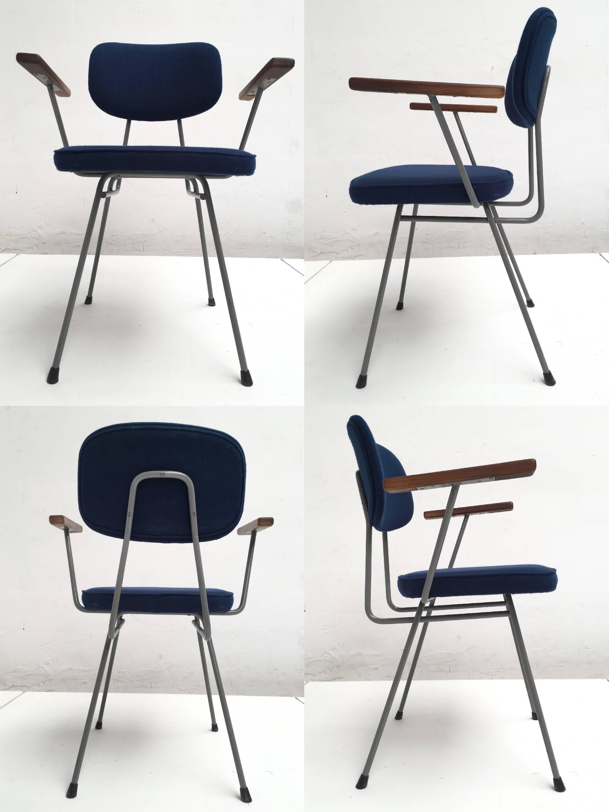 A rare set of ten armrest chairs produced by Kembo The Netherlands, early 1950s

Top quality production in solid metal grey enameled frame and petrol blue wool upholstered seat and back with carved armrests in mahogany hardwood

This set has