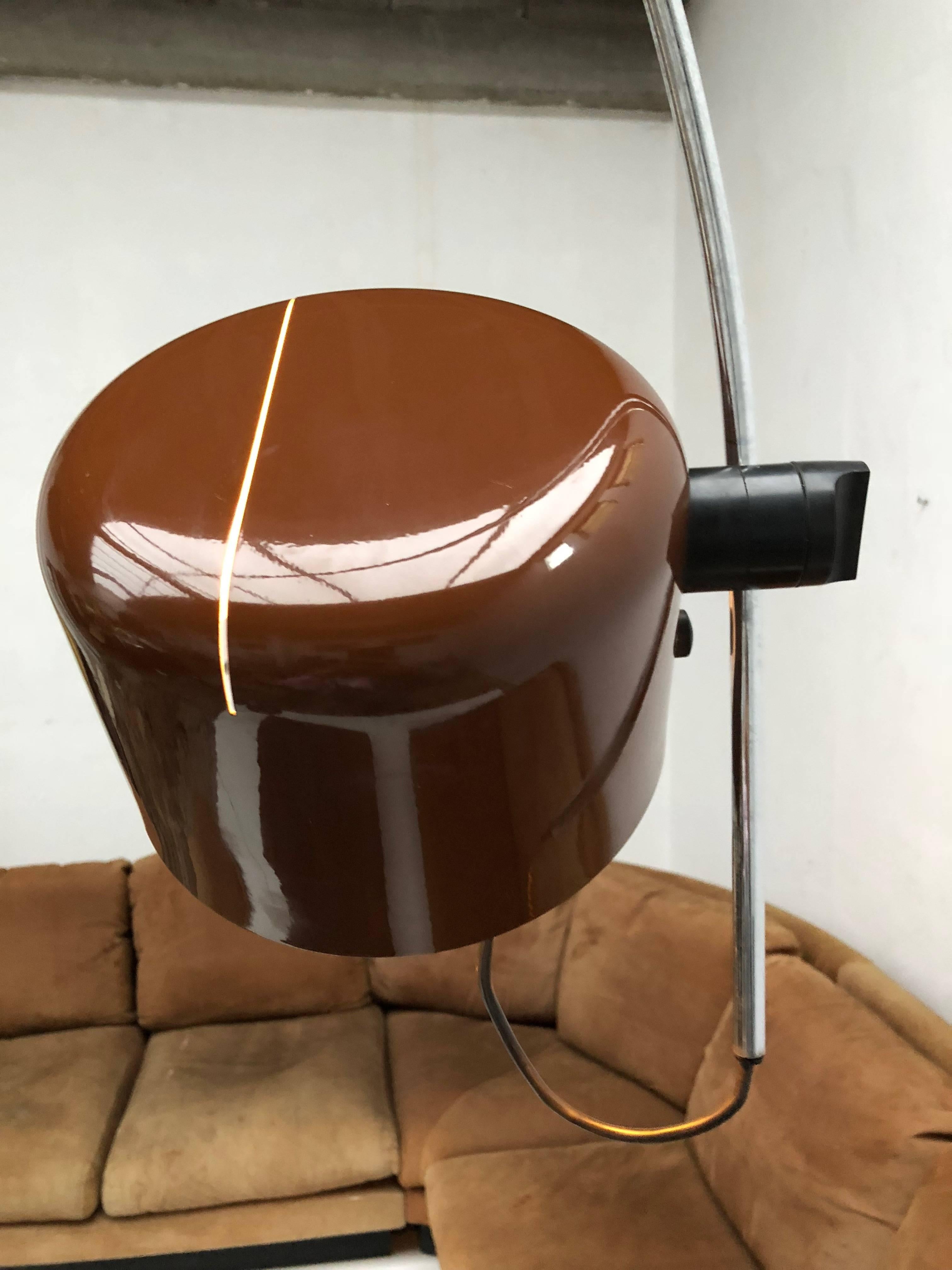 Adjustable, arched "Coupe" floor lamp with aluminium reflector, chrome armature, and lacquered metal base
Design by Joe Colombo and produced by O-Luce, circa 1970
A sophisticated design that is complex to manufacture, the lamp features a