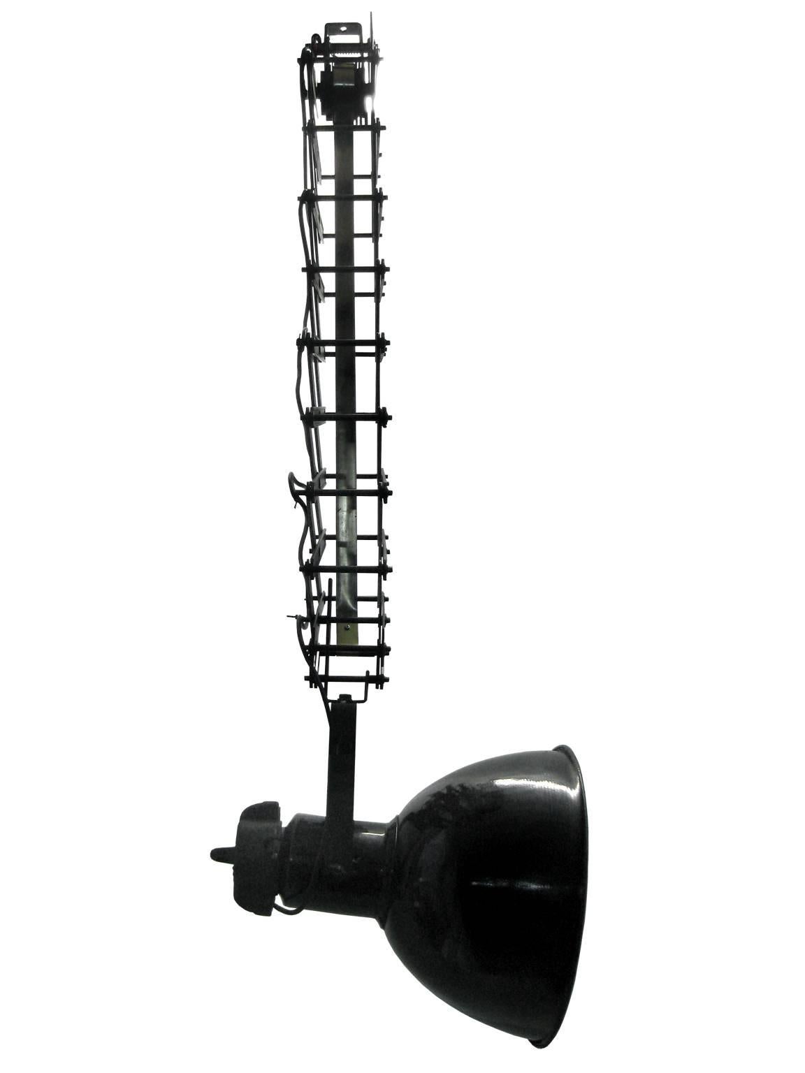 Scissor spring with Industrial hanging lamp. Black enamel white interior.
Measures: Max. length 250cm min. length 80cm. E27 fitting max 150W.

All lamps have been made suitable by international standards for incandescent light bulbs,