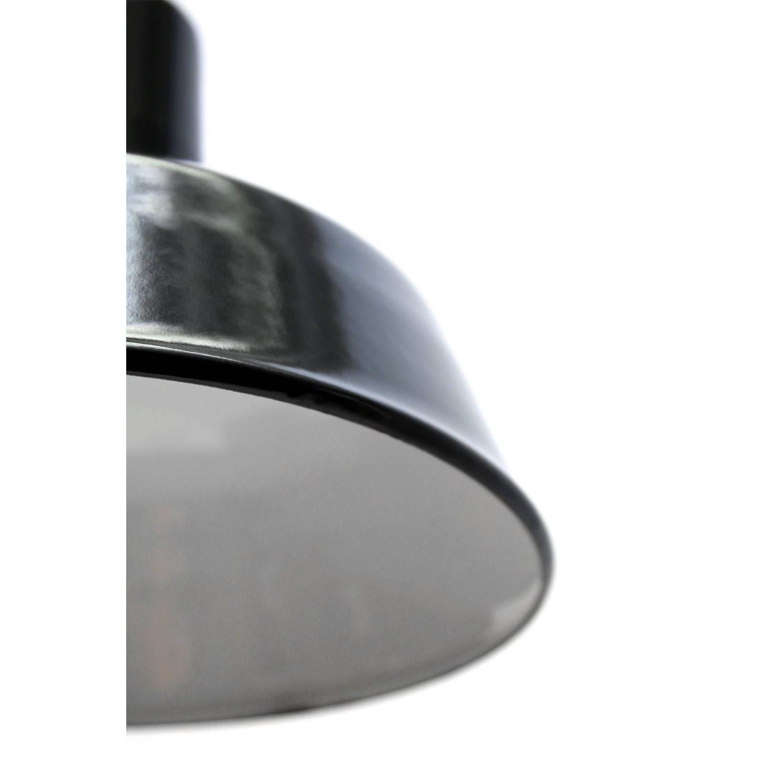 Factory hanging light. Black / very dark grey enamel, white interior.
E27 or E26 max. 150W.

All lamps have been made suitable by international standards for incandescent light bulbs, energy-efficient and LED bulbs with an E26/E27 socket, new