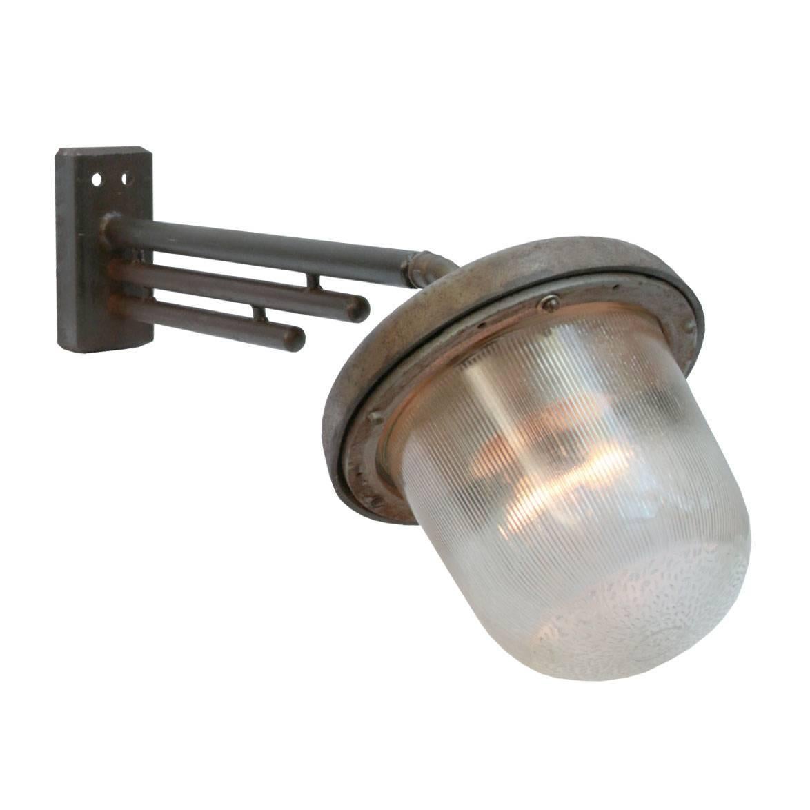 Large Industrial wall light. Cast iron arm with Holophane glass. Size wall mount: width 8 cm, height 19 cm. 2 holes to secure. Max. 150W E27 or E26.

All lamps have been made suitable by international standards for incandescent light bulbs,