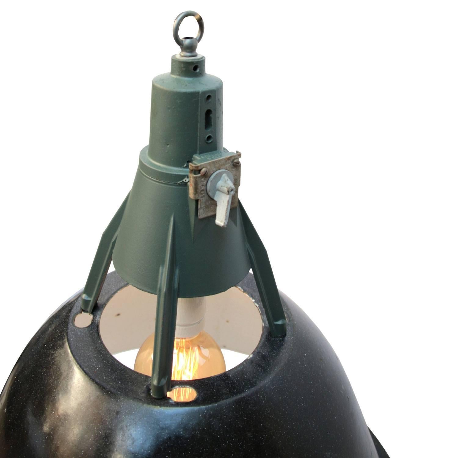 Busk Large Black . Enamel industrial pendant. Black enamel shade, white inside.
Dark grey/green cast aluminium top.

All lamps have been made suitable by international standards for incandescent light bulbs, energy-efficient and LED bulbs with an