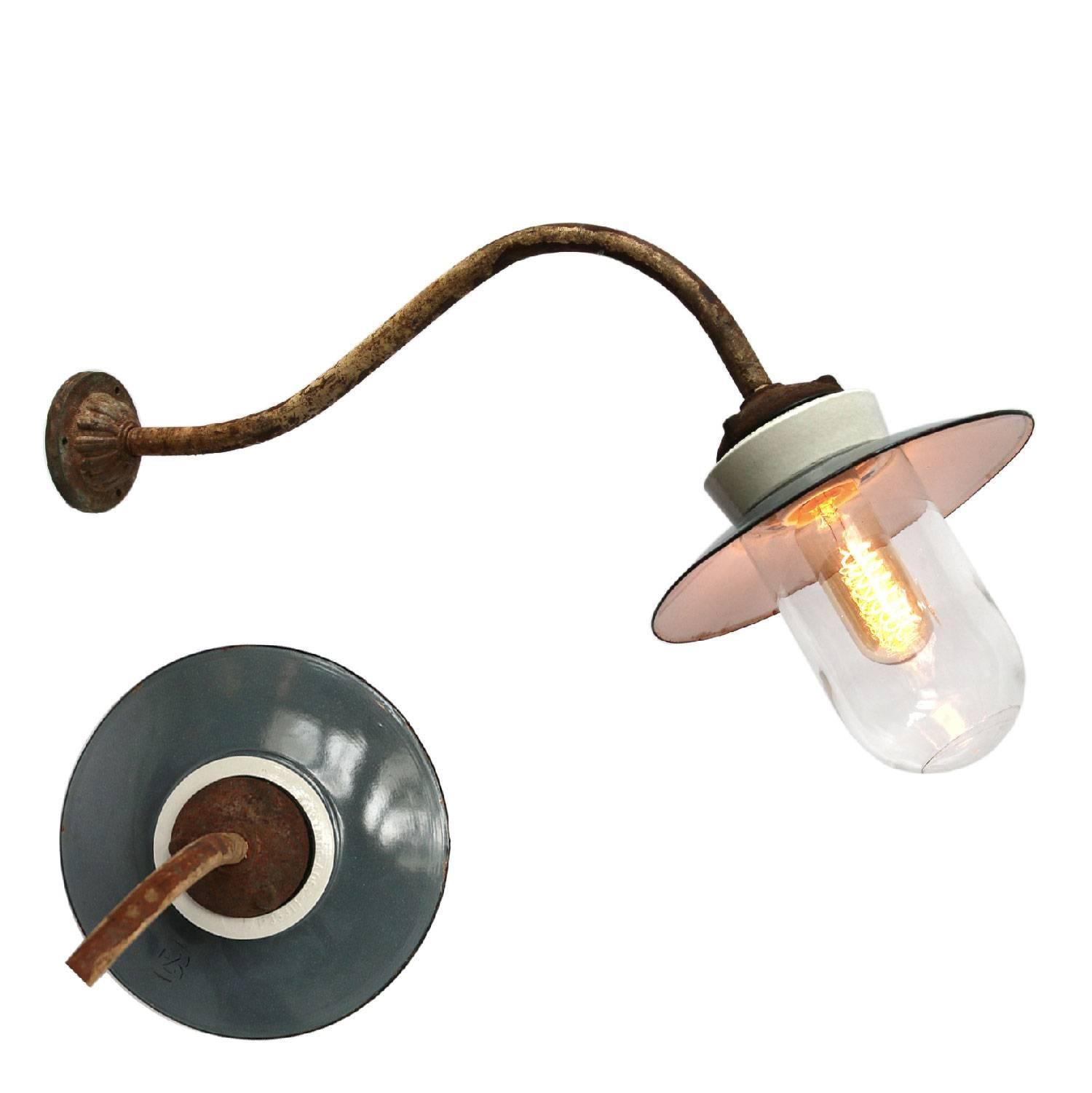 Gray/blue colored enamel industrial wall light with white interior.
Cast iron and porcelain top, clear glass.
Enamel shade available in multiple colors.
Diameter cast iron wall mount: 9 cm, 3 holes to secure.

All lamps have been made suitable