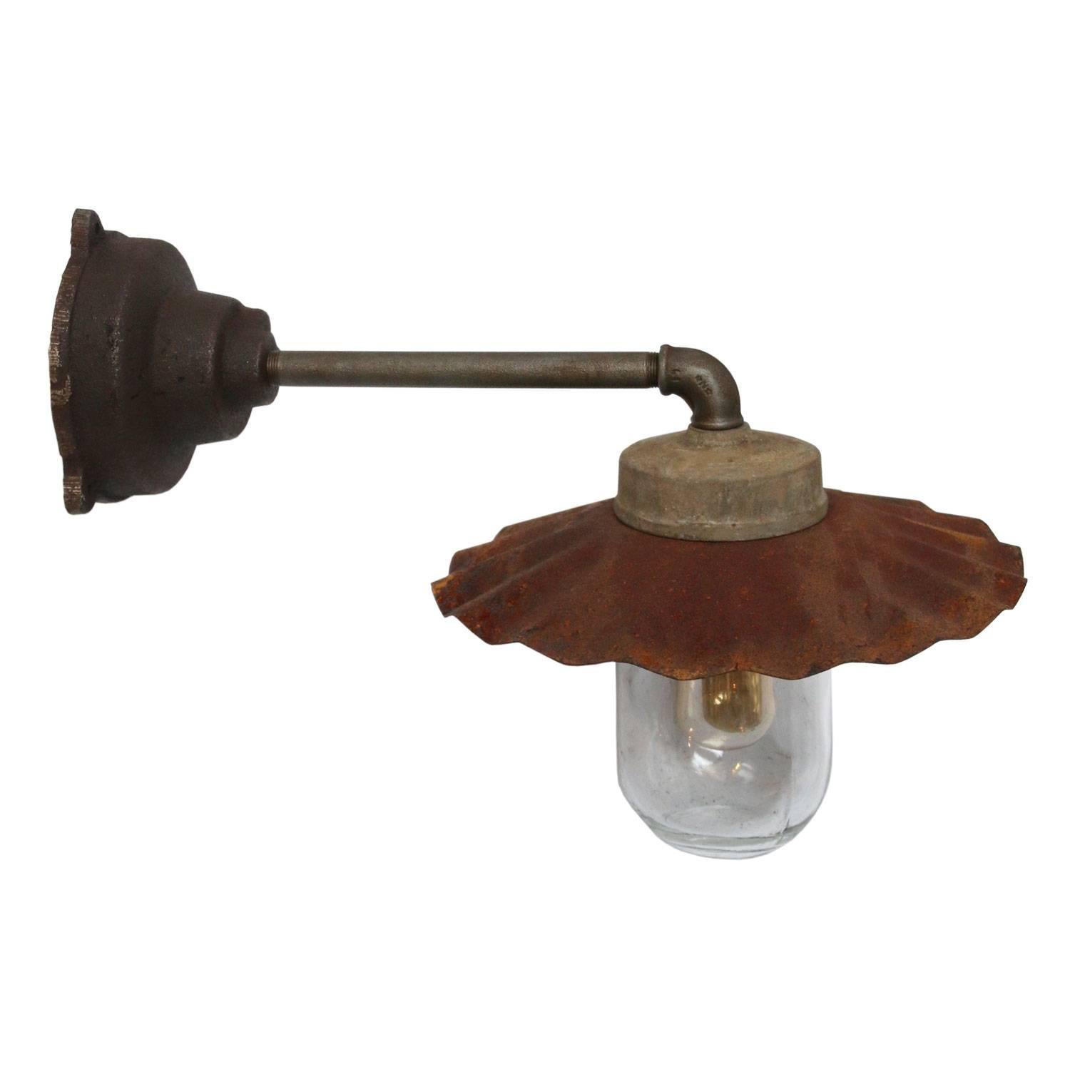 Industrial wall light with rusty shade and clear glass.

Weight: 3.2 kg / 7,1 lb

All lamps have been made suitable by international standards for incandescent light bulbs, energy-efficient and LED bulbs. E26/E27 bulb holders and new wiring are CE