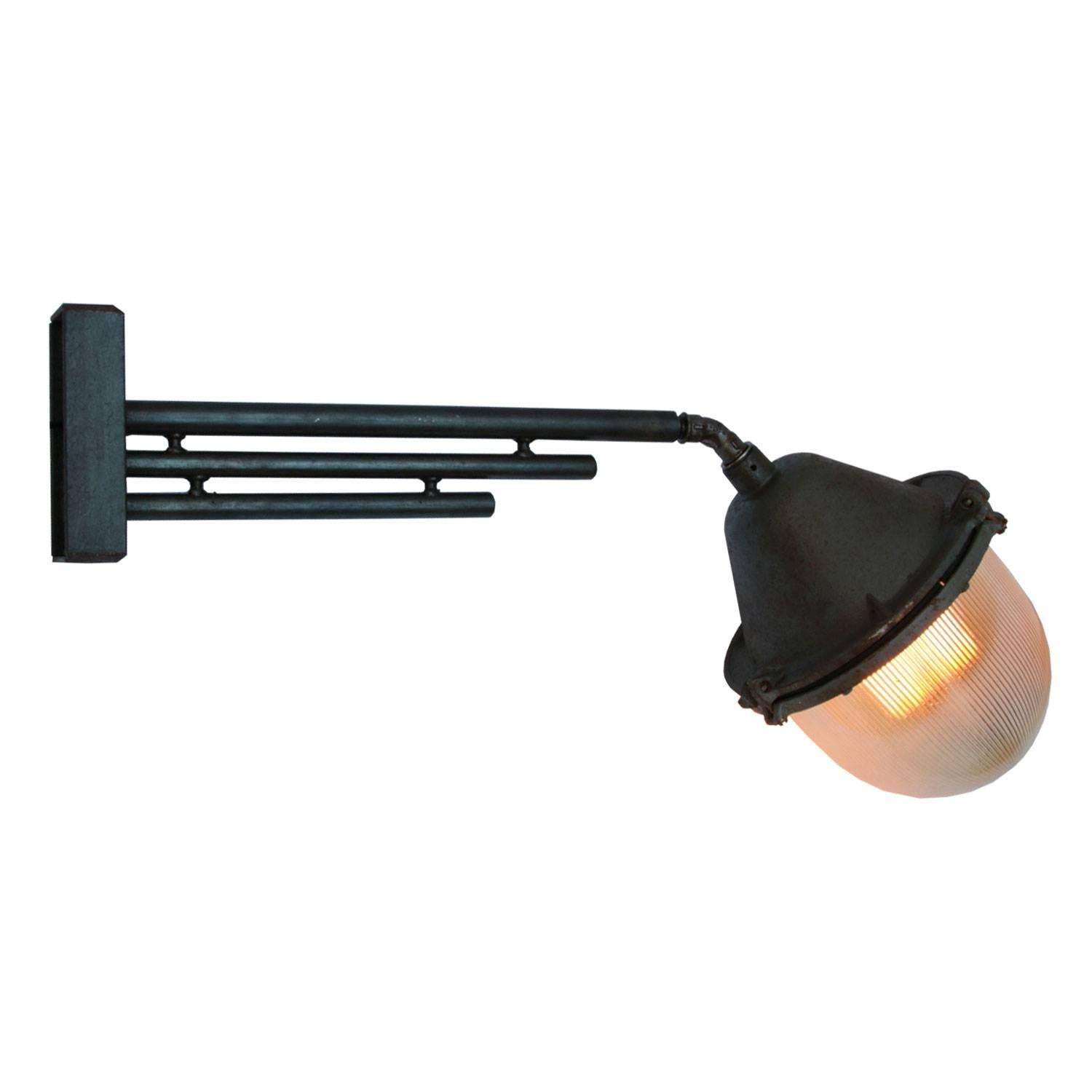 Large industrial wall light. Cast iron arm with Holophane glass.
Size wall mount: width 8 cm, height 190cm. 2 holes to secure,

Weight: 11.0 kg / 24.3 lb

All lamps have been made suitable by international standards for incandescent light bulbs,