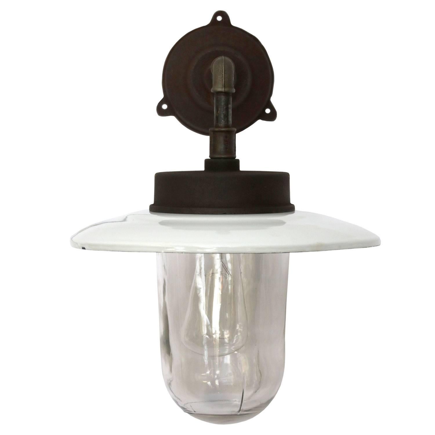 White enamel Industrial wall light. Clear glass. Measures: Diameter cast iron wall piece: 12 cm. Three holes to secure.

Weight: 6.5 kg / 14.3 lb

All lamps have been made suitable by international standards for incandescent light bulbs,