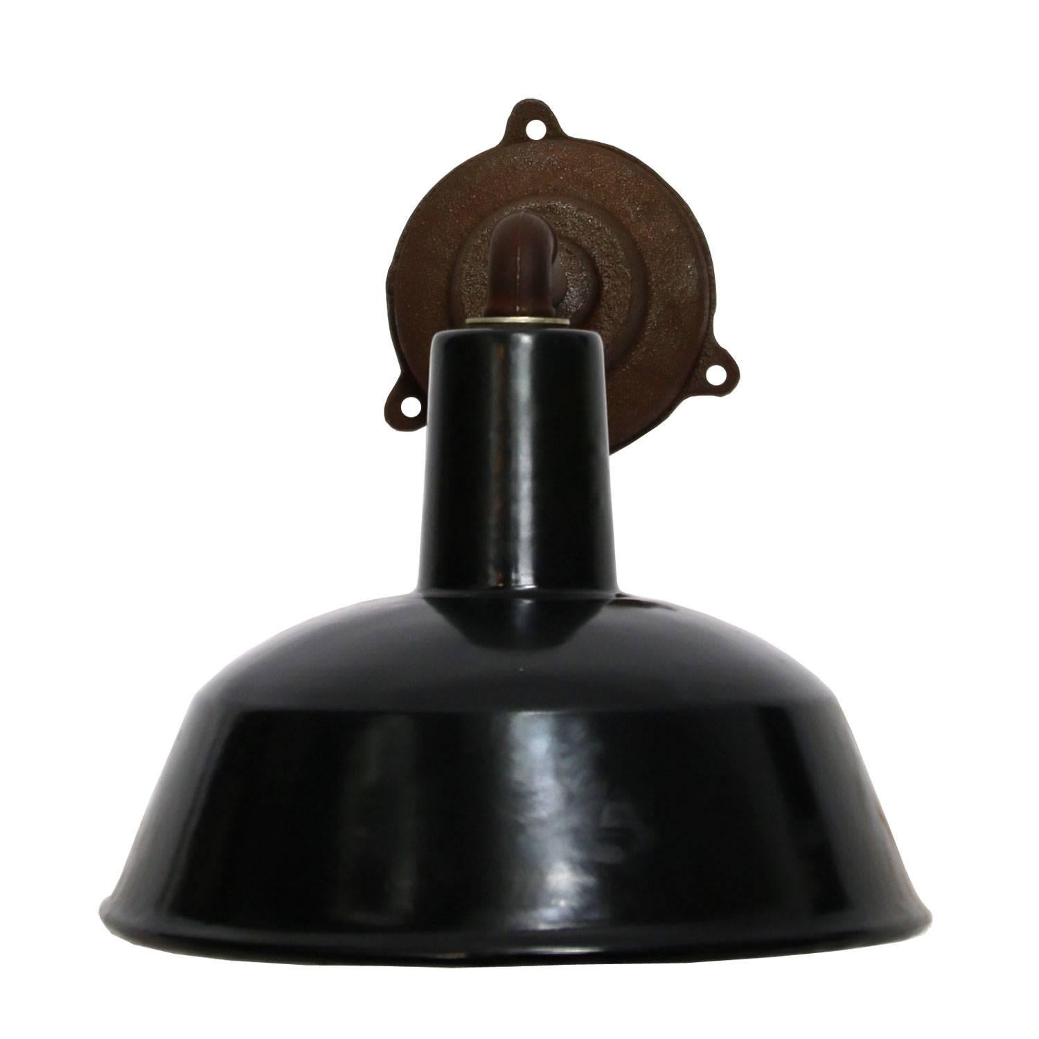 Factory wall light. Black enamel. White interior. Diameter cast iron wall piece: 12 cm, three holes to secure.

Weight: 2.5 kg / 5.5 lb

All lamps have been made suitable by international standards for incandescent light bulbs, energy-efficient and