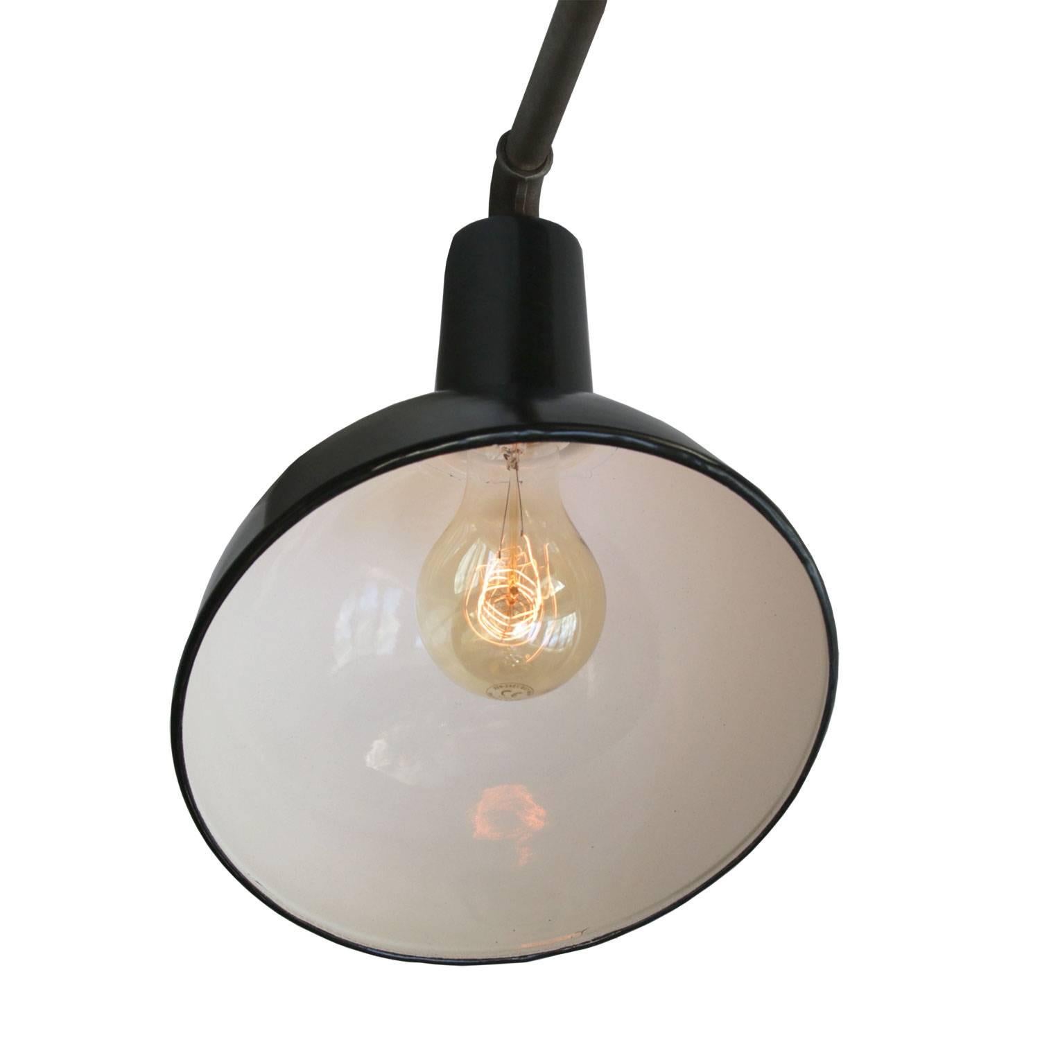 Factory wall light. Black enamel. White interior. Measures: Diameter cast iron wall piece 12 cm, 3 holes to secure.

Weight: 2.9 kg / 6.4 lb

Priced individual item. All lamps have been made suitable by international standards for incandescent light