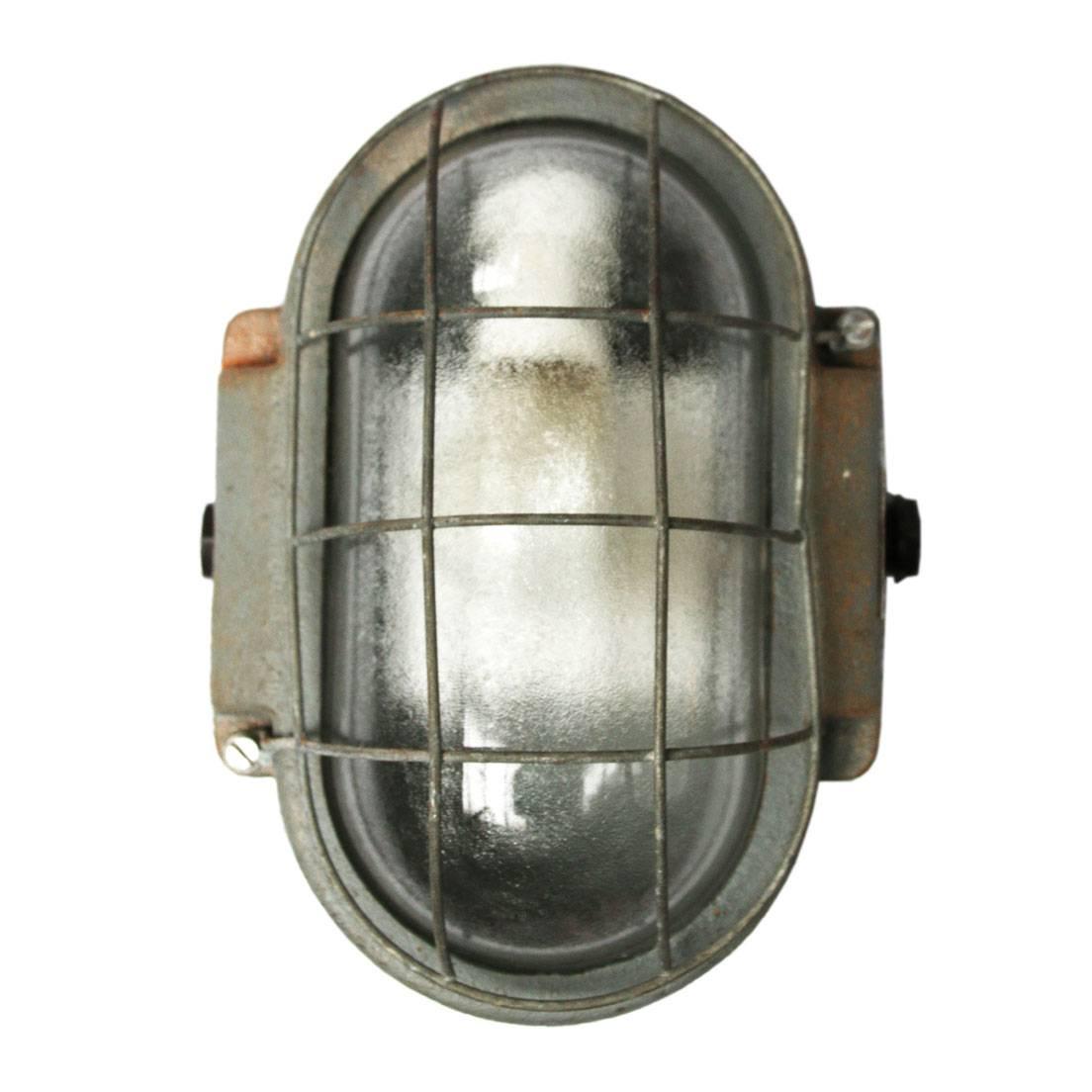 Blazim semi. Industrial wall-lamp. Cast iron. Semi frosted glass.
Suitable for use outside.

Measure: Weight 6.0 kg / 13.2 lb

All lamps have been made suitable by international standards for incandescent light bulbs, energy-efficient and LED
