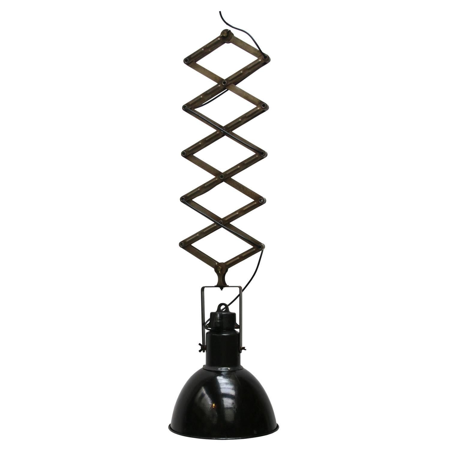 Scissor spring with industrial hanging lamp. 
Black enamel white interior. Max. length 250cm. Min. length 80cm.

Measure: Weight 6.5 kg / 14.3 lb

All lamps have been made suitable by international standards for incandescent light bulbs,