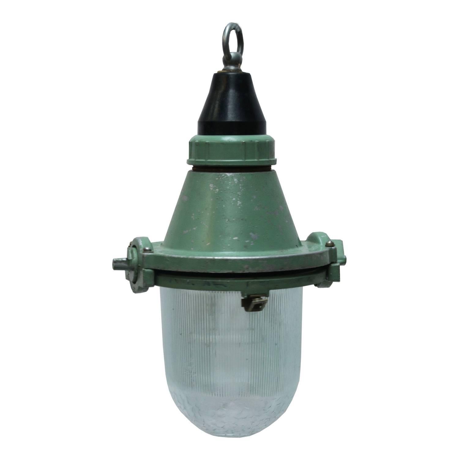 Small green industrial light with Holophane glass. 

Weight: 1.5 kg / 3.3 lb

All lamps have been made suitable by international standards for incandescent light bulbs, energy-efficient and LED bulbs. E26/E27 bulb holders and new wiring are CE