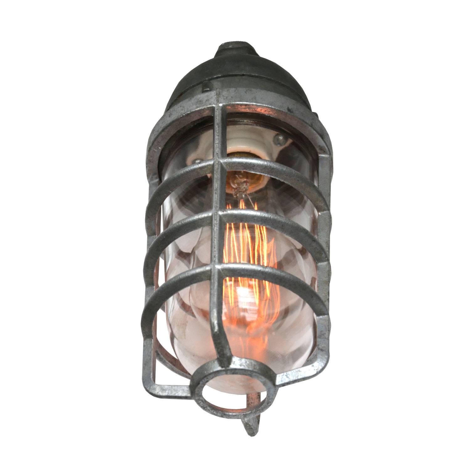Vintage American industrial cage light. Cast aluminium. Clear glass.

Weight: 1.0 kg / 2.2 lb

All lamps have been made suitable by international standards for incandescent light bulbs, energy-efficient and LED bulbs. E26/E27 bulb holders and new