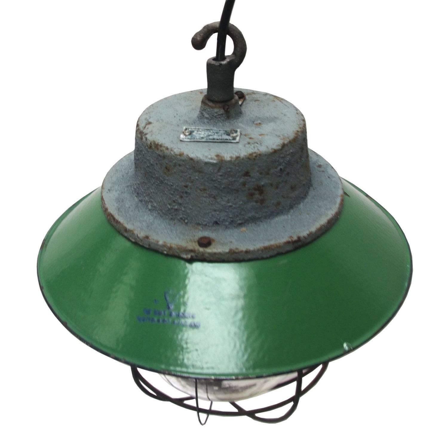 Green enamel. White interior.
Cast iron top. Clear glass. 

Weight: 5.0 kg / 11 lb

Priced per individual item. All lamps have been made suitable by international standards for incandescent light bulbs, energy-efficient and LED bulbs. E26/E27 bulb