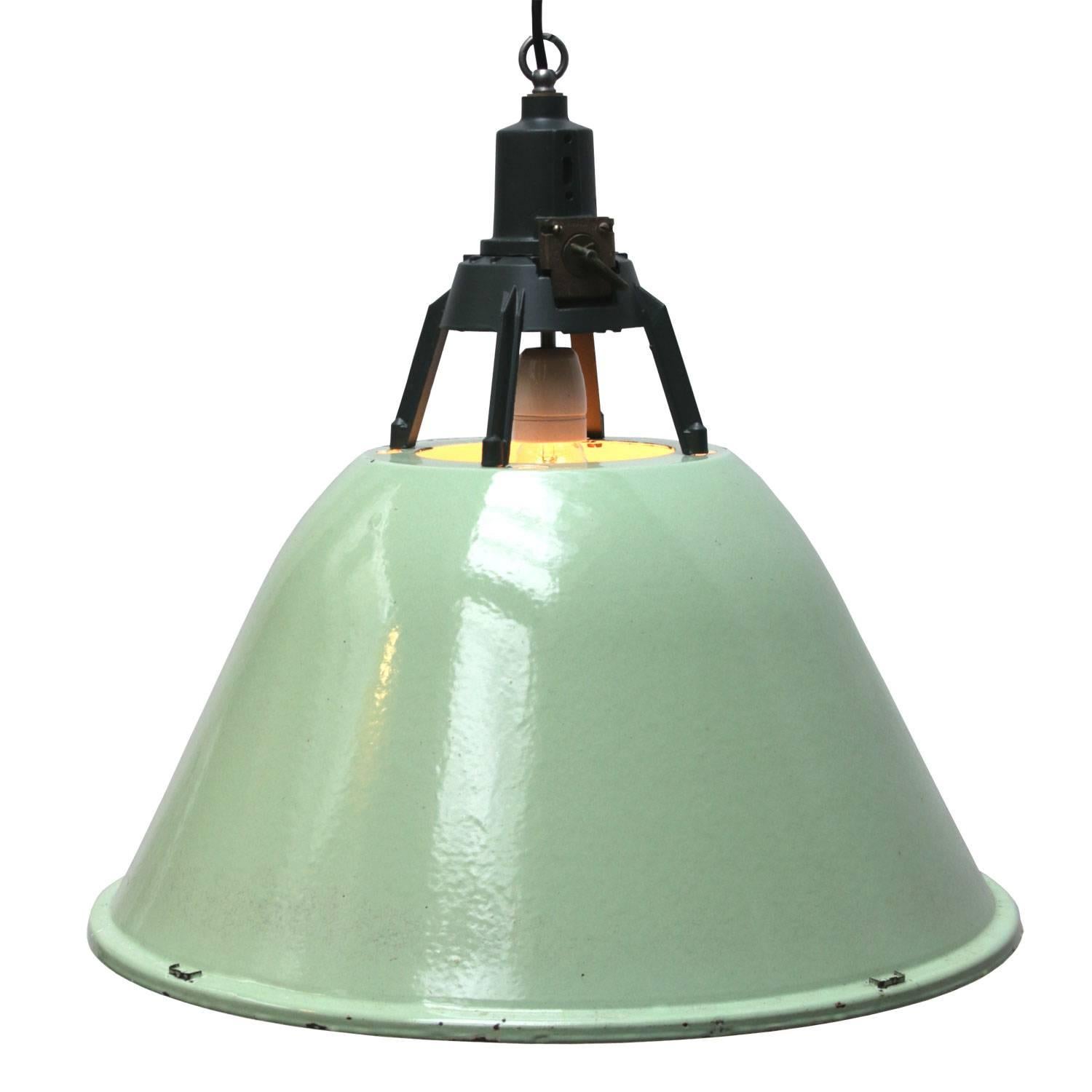 Enamel Industrial pendant. Green enamel shade. White inside.
Dark grey / green cast aluminium top.

Weight: 4.0 kg / 8.8 lb

All lamps have been made suitable by international standards for incandescent light bulbs, energy-efficient and LED
