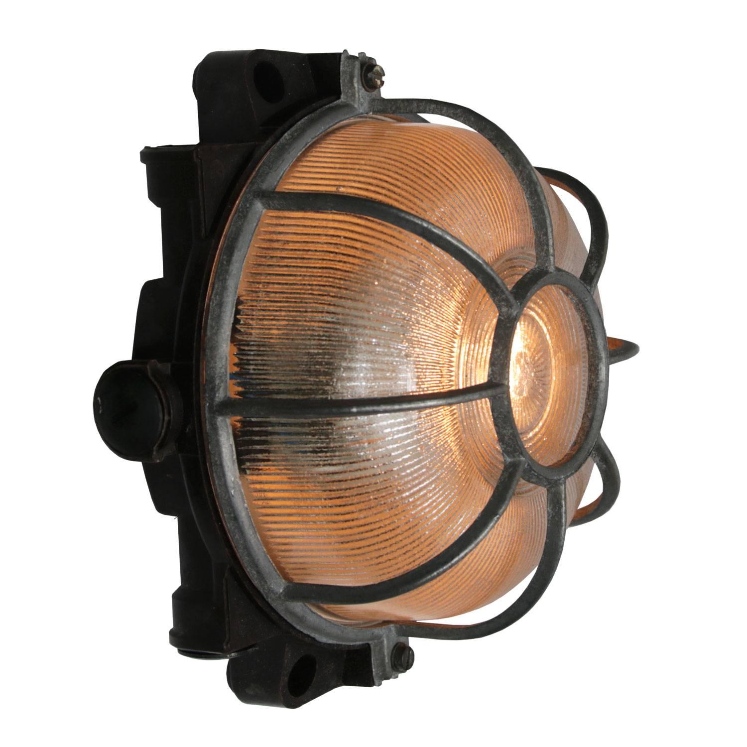 Industrial wall and ceiling scone. Bakelite back. Holophane striped glass.
Aluminium frame.

Measure: Weight 1.0 kg / 2.2 lb

Priced individual item. All lamps have been made suitable by international standards for incandescent light bulbs,