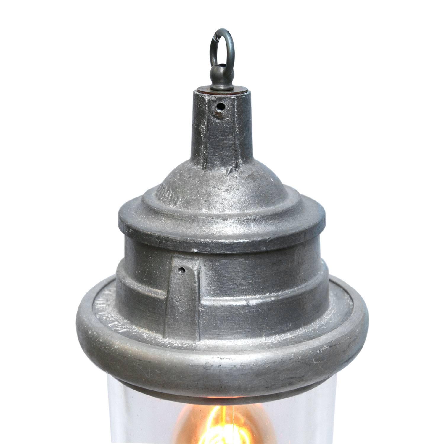 Ukrainian Industrial hanging lamp. Silver gray cast aluminium. Clear glass.

Priced per individual item. All lamps have been made suitable by international standards for incandescent light bulbs, energy-efficient and LED bulbs. E26/E27 bulb