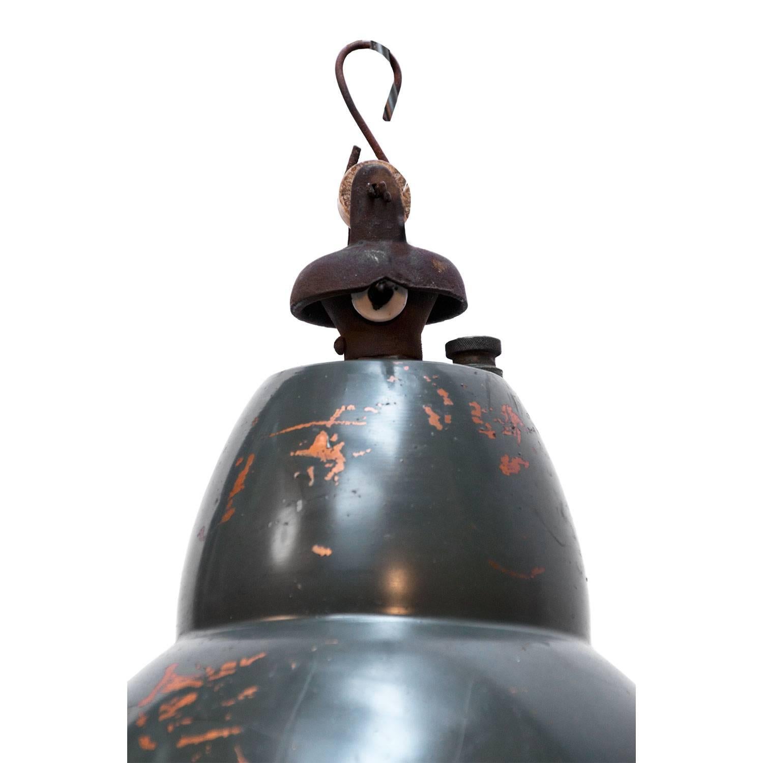 Rare French factory pendant with rounded glass. Metal with frosted glass. Cast iron top. weight 3.7 kg / 8.2 lb. For use outdoors as well as indoors.  

All lamps have been made suitable by international standards for incandescent light bulbs,