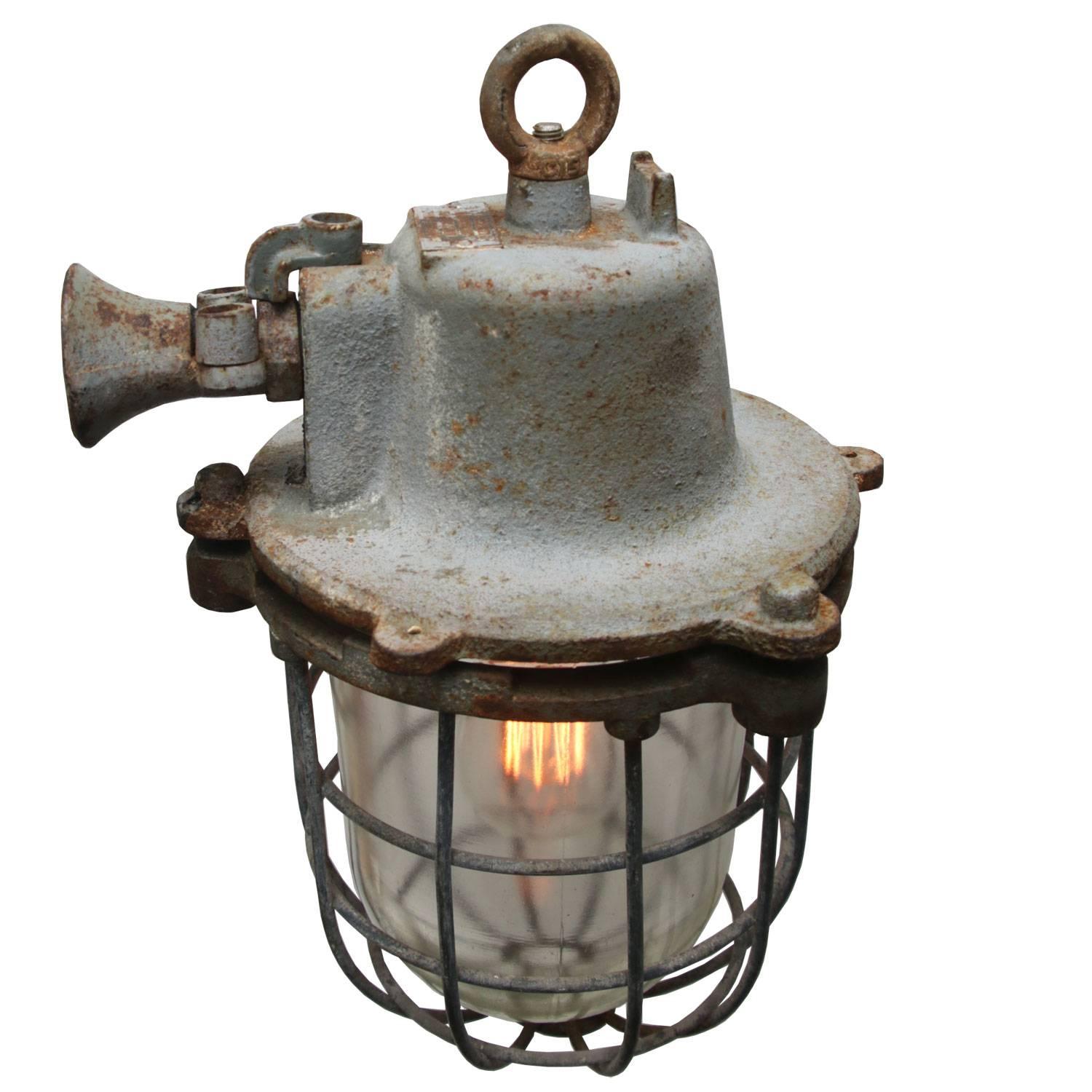 Vintage European Industrial hanging lamp. Cast iron with clear glass. 

Weight 9.5 kg / 20.9 lb

All lamps have been made suitable by international standards for incandescent light bulbs, energy-efficient and LED bulbs with an E27 socket, max 150W.