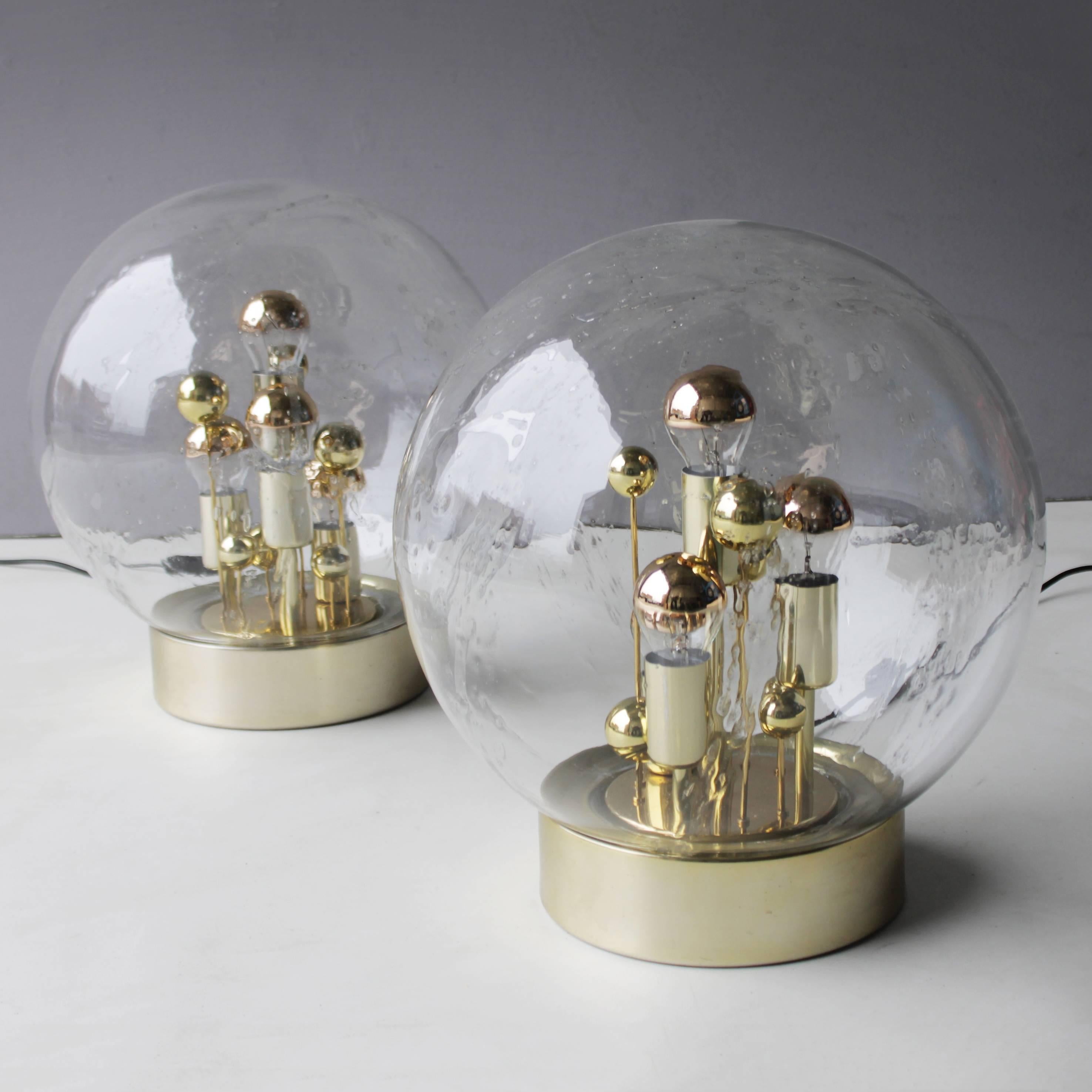 Two (2) Doria gold globe table or floor lights. Design by Walter Donner for Doria Leuchten Germany. Four reflector bulbs. Excellent condition. Marked.