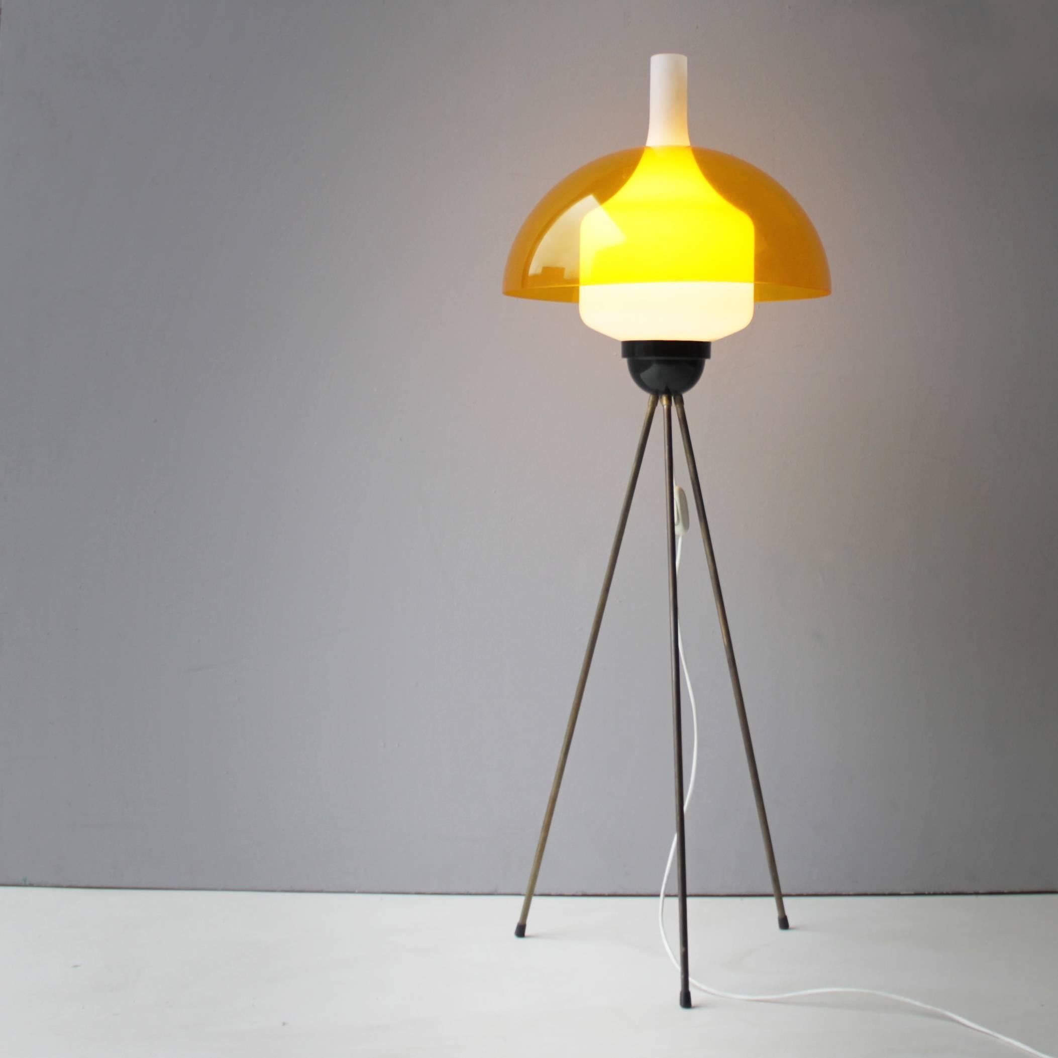 Tripod floor lamp by Stilux Italy. Combination of perspex, opaline glass, brass and black lacquered metal.
Measurements: Diameter 15.7 in. (40 cm): height 29.3 inches (74,5 cm).
Alongside with companies like Arteluce, Arredoluce and Stilnovo,