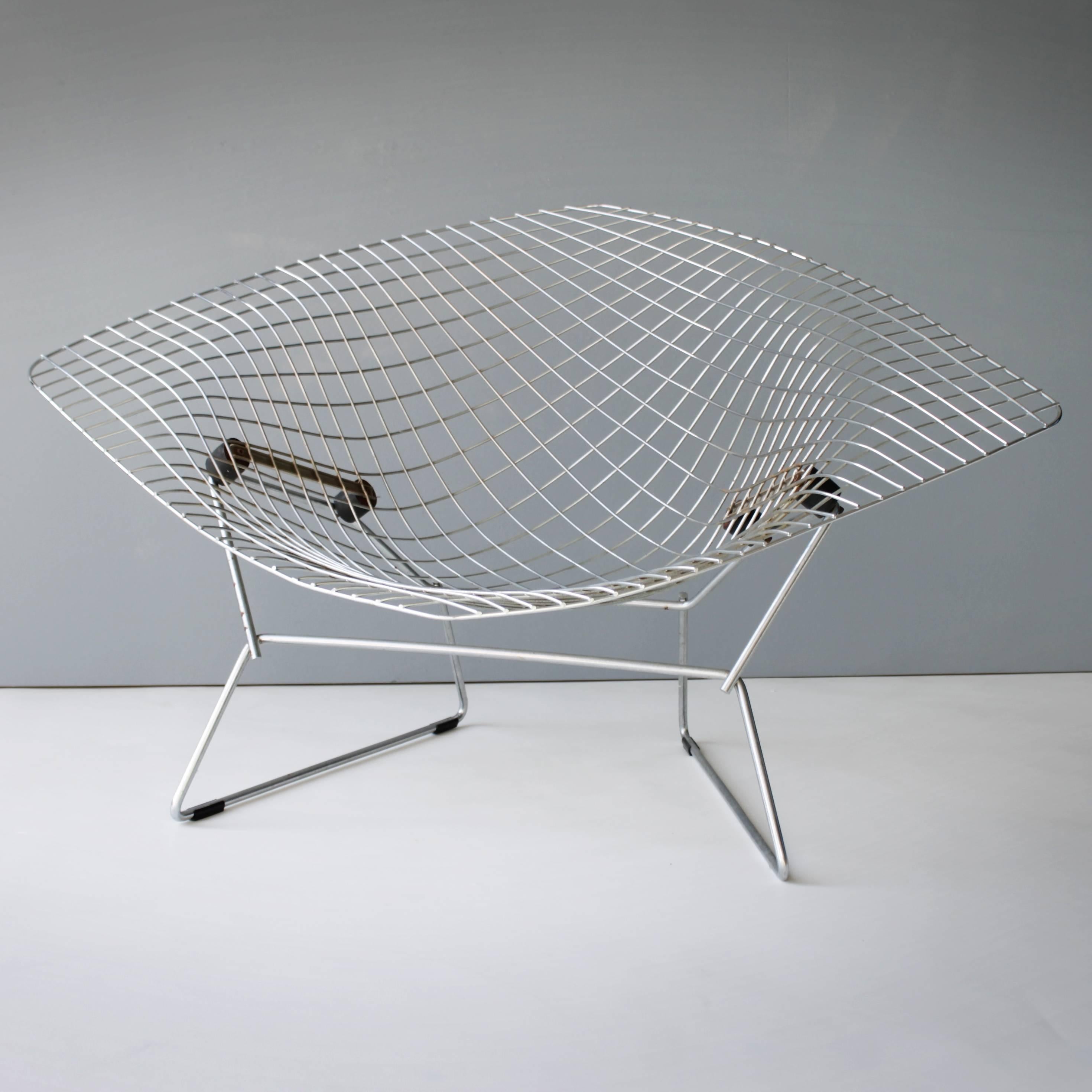 Early large Diamond chair by Harry Bertoia for Knoll. Welded and chromed steel, rubber (shock mounts).

Italian-born American, Arieto ‘Harry’ Bertoia (1915-1978) was a multi talented artist. His artistic output ranges from jewelry to works in
