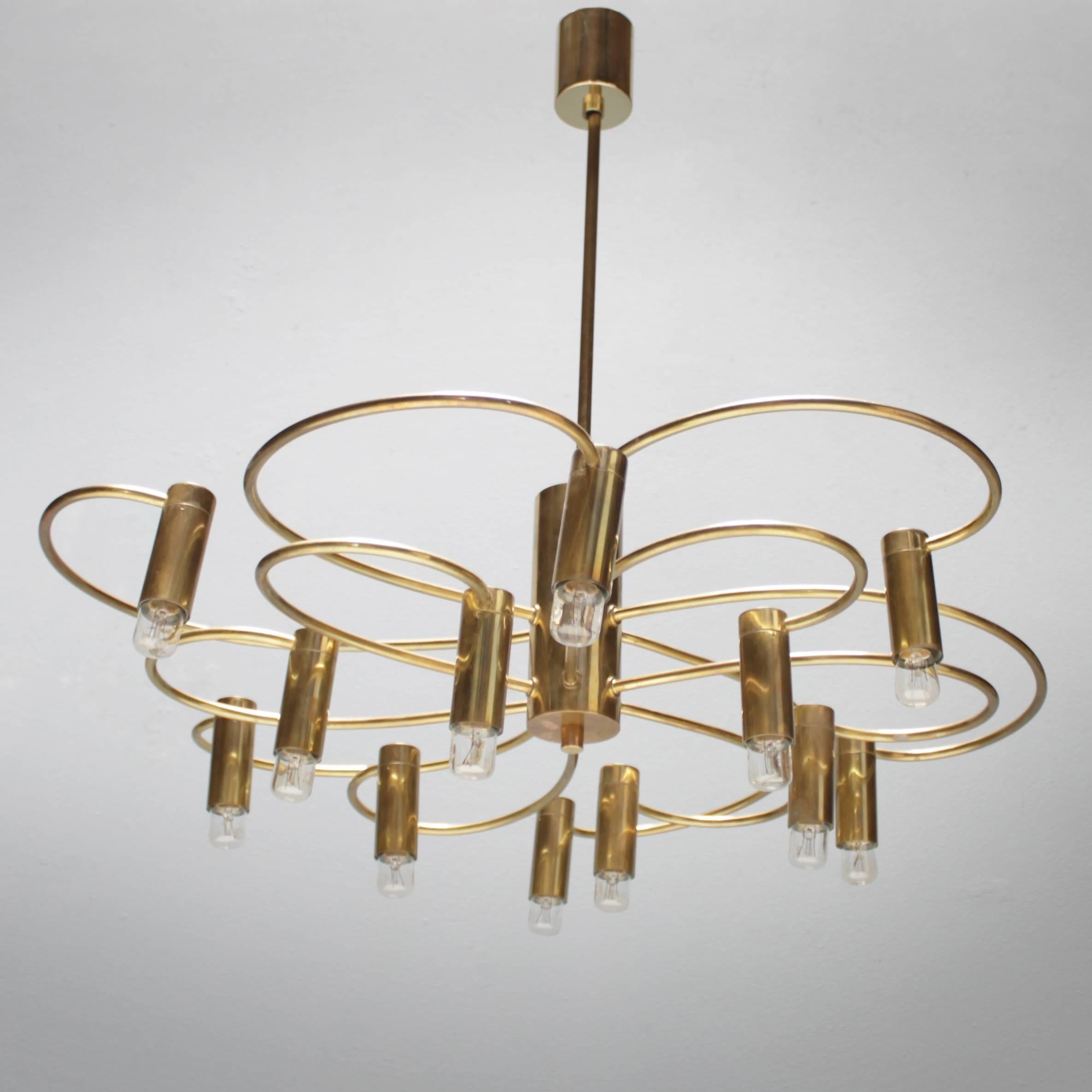 Twelve-lights brass chandelier by Gaetano Sciolari for S.A. Boulanger Belgium. Dimensions: Height from ceiling till drop 23.6 inches (60 cm), width 22.0 in. (56 cm).