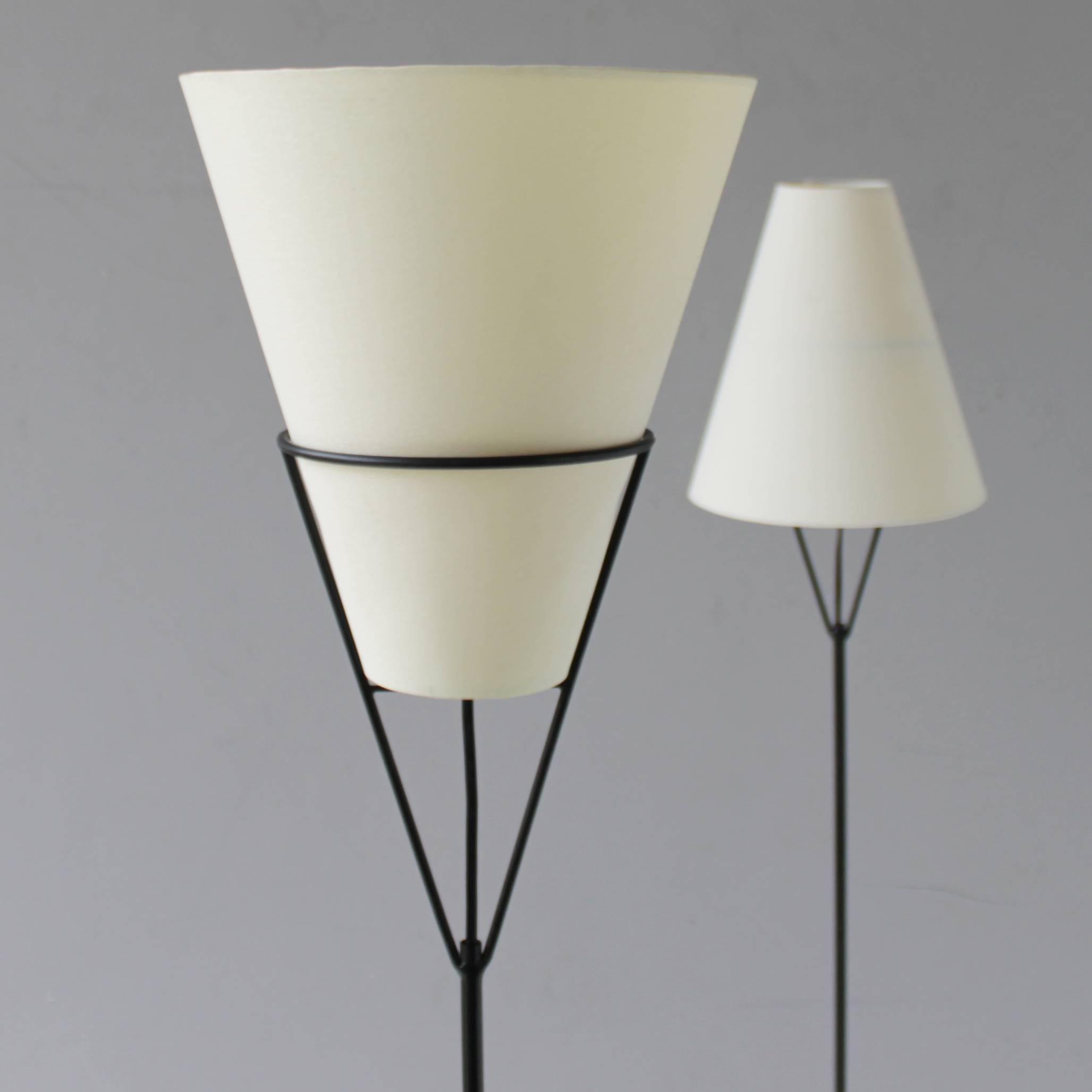 Pair of 'Vice Versa' floor lamps by Carl Auböck, Austria. Also known as 'Die Umkehr Lampe'. Beautiful elegant lamp on a heavy iron base. Modernistic design from the 1950s. Multifunctional, both uplighting as downlighting, depending of the position