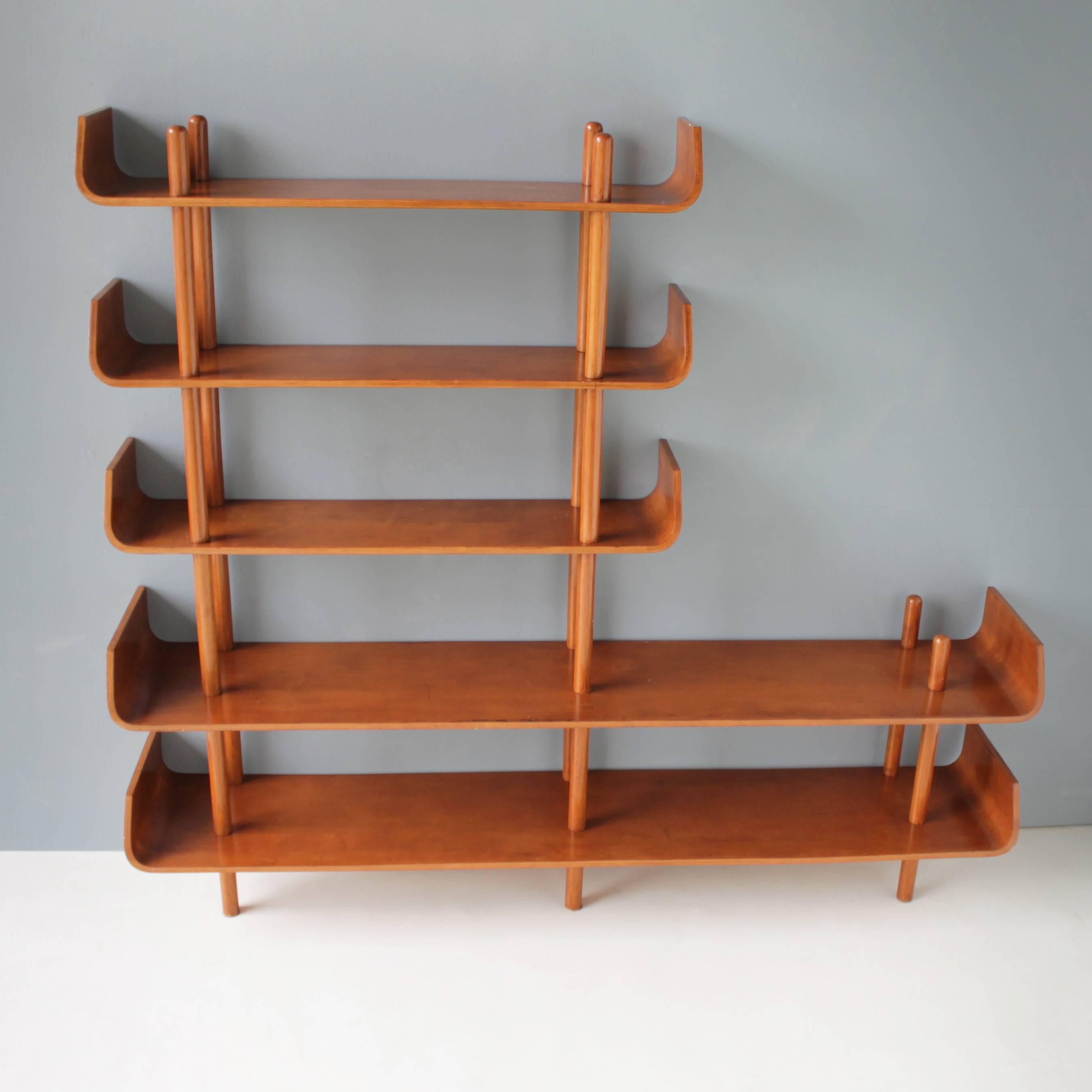 Dutch teak shelving unit by Willem Lutjens for Gouda Den Boer. Birch wooden stands and teak plywood shelves, can be used as a room divider or a bookcase.
Dimensions: Length of the two large shelves 59.0 in. (150 cm), depth 11.5 in. (29,3 cm).