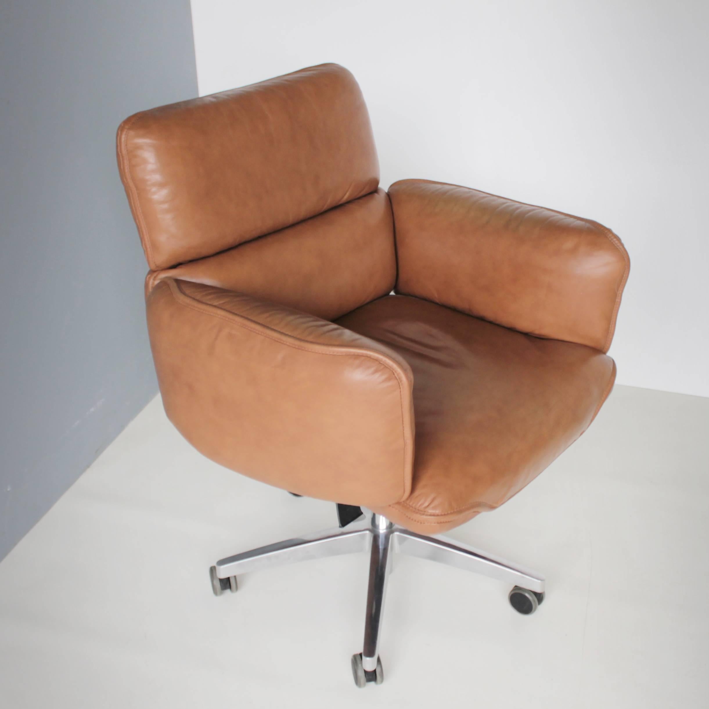 This comfortable office or desk chair was designed by Otto Zapf in the seventies. It's a high quality executive chair in a beautiful cognac leather. Adjustable, tilt and swivel chair on five-star base with twin wheels. This version is manufactured