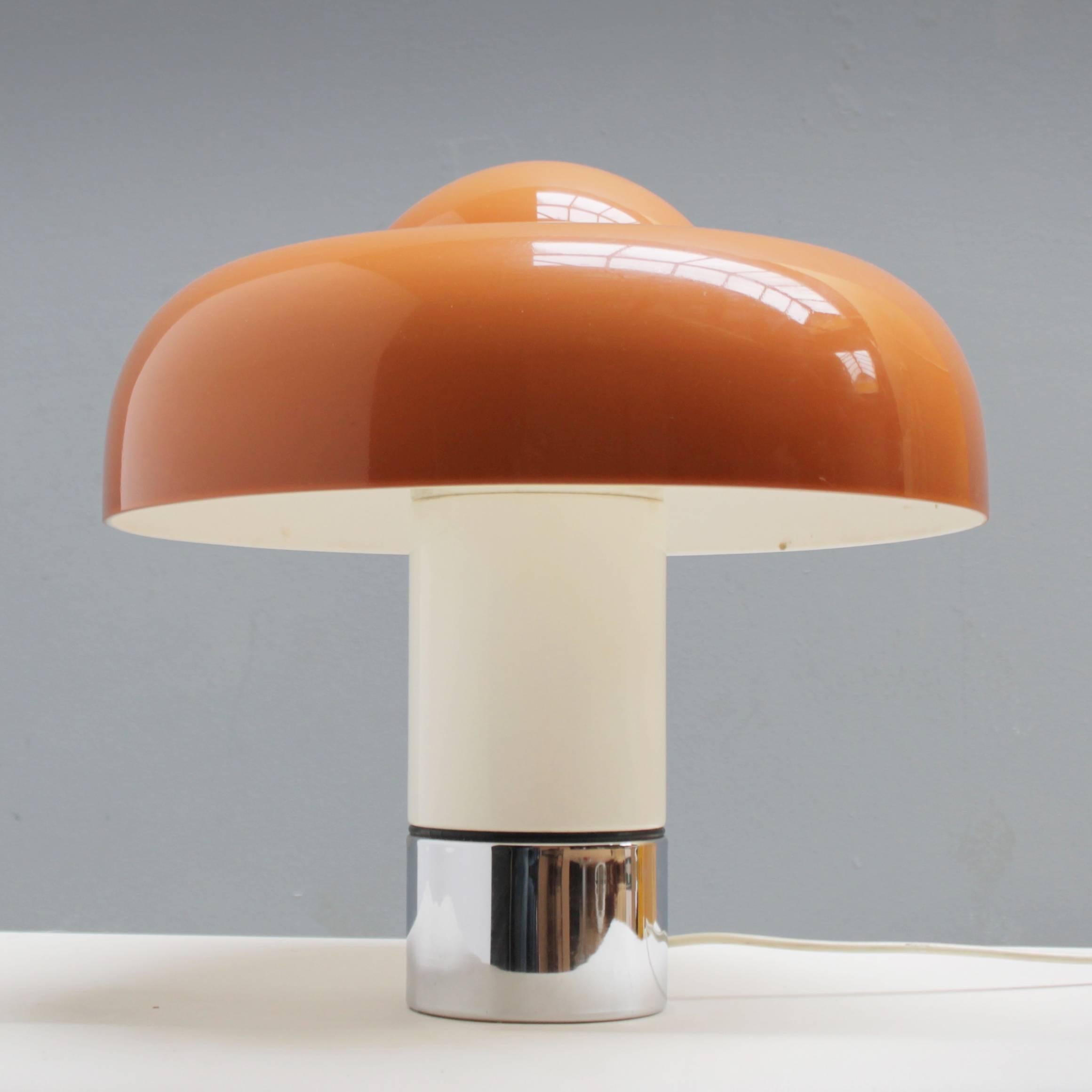 Brumbury table lamp designed by Luigi Massoni, manufactured in 1969 by Harvey Guzzini, Italy. Heavy foot of metal (white varnish and chrome-plated), the shade is made of brown opal acrylic. 
Measurements: Height: 18.1 in. (46 cm), diameter shade: