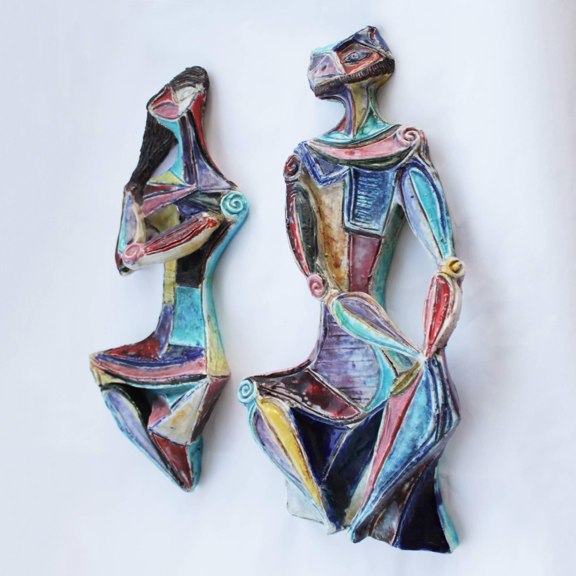This is a beautiful example of Marcello Fantoni’s best and rarest lines – his cubist figure sculptures of the mid-1950’s. A rare pair of glazed ceramic wall sculptures. Both signed with the early Fantoni monogram and signature plus the mark 'Fantoni