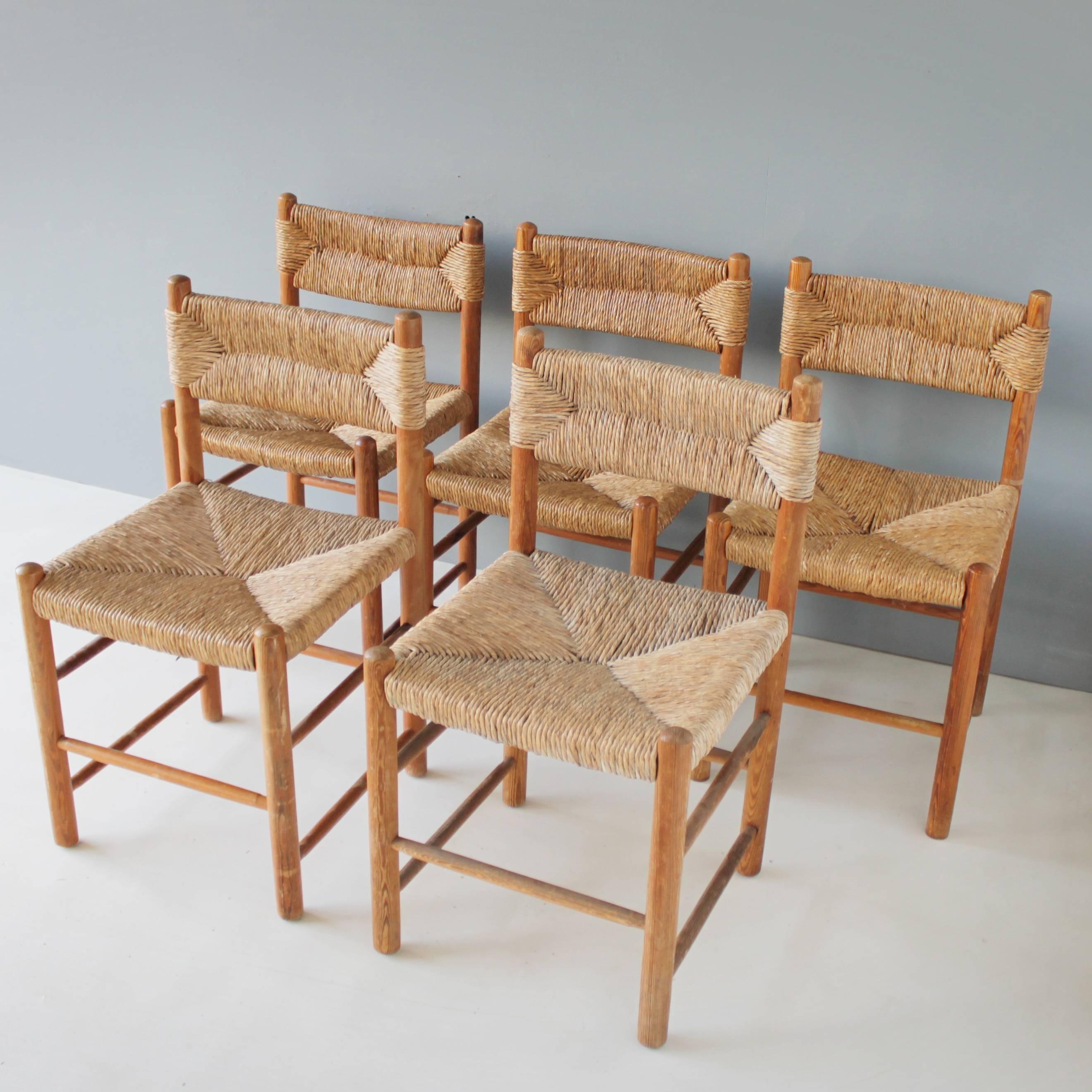 A set of five rush chairs attributed to Charlotte Perriand for BCC George Blanchon, Grenoble, model 18. Beautiful good and original condition.
Dimensions: Height 31.9 in. (81 cm), width 17.5 in. (44.5 cm), depth 18.5 in. (47 cm), seat height: 17.3
