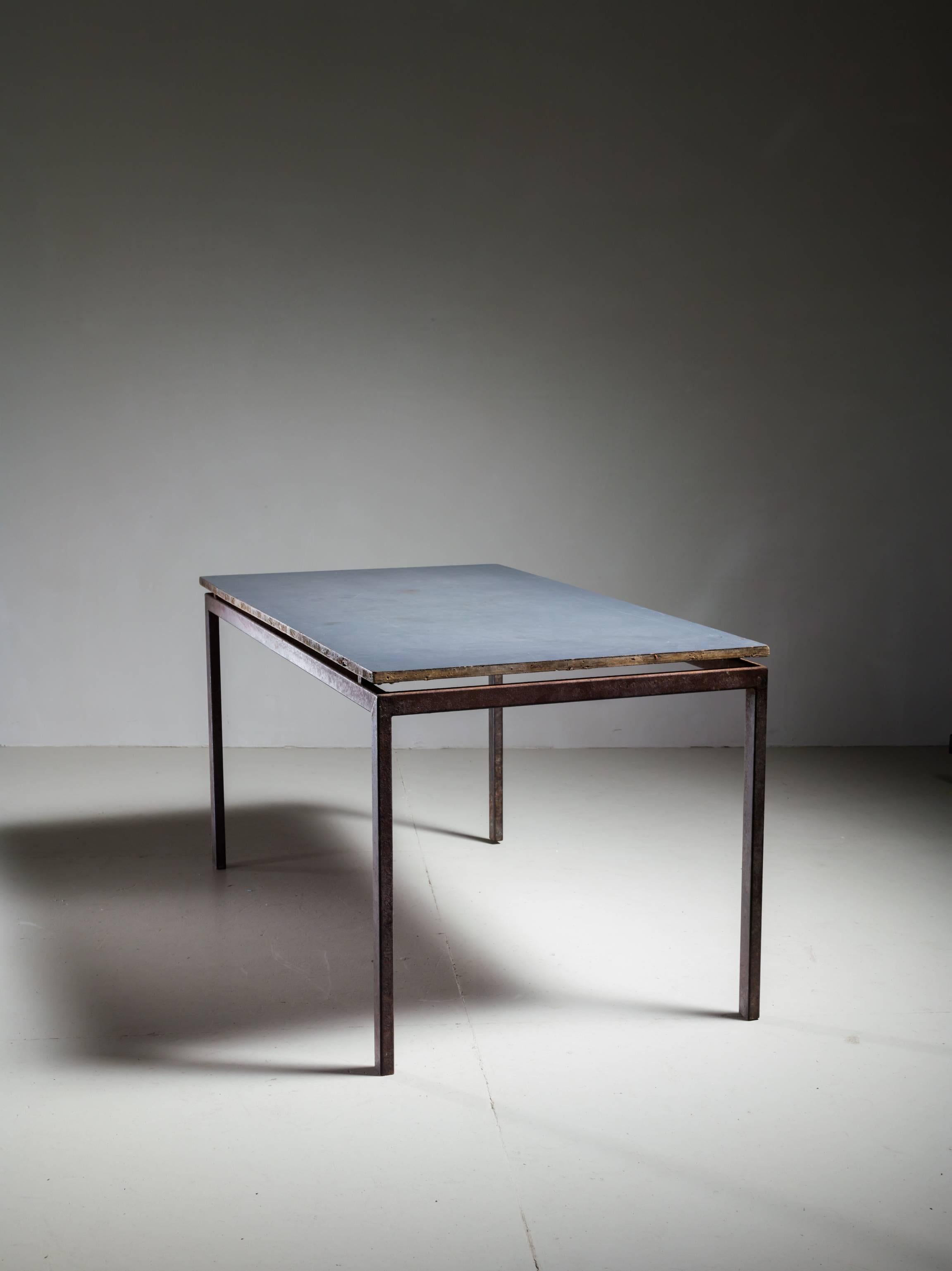 A table, designed by Charlotte Perriand for Cité Cansado, Mauritania. This table was designed in 1958 and editioned by Steph Simon, France.
The top, of plastic laminate on oak slats, rests, but almost seems to float, on a painted steel frame. This