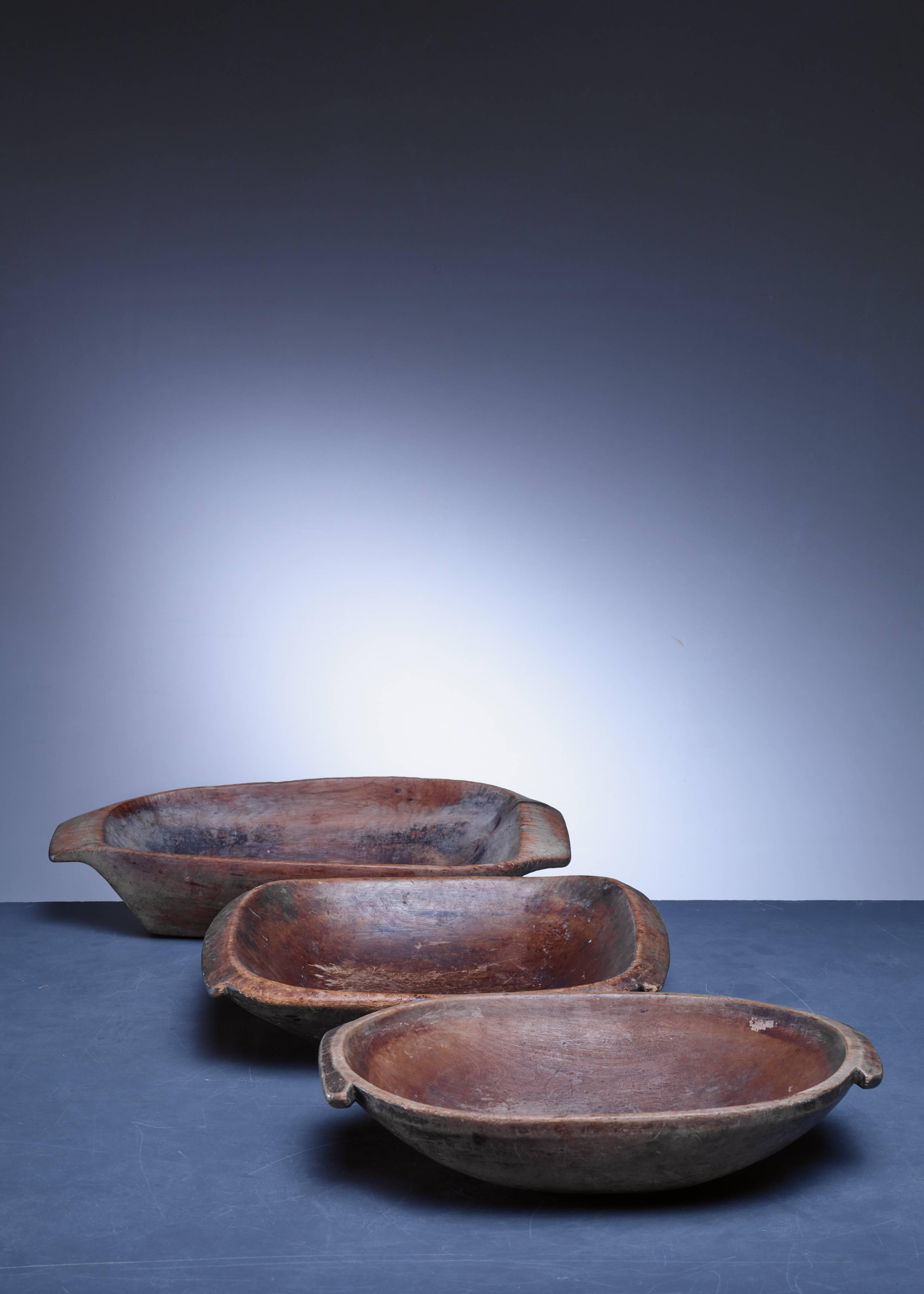 A pair of Swedish wooden folk art bowls with grips.

The measurements stated are of the oval bowl. The other one is 34 by 28.5 cm.

The third bowl in the background of the first picture has already been sold.
 