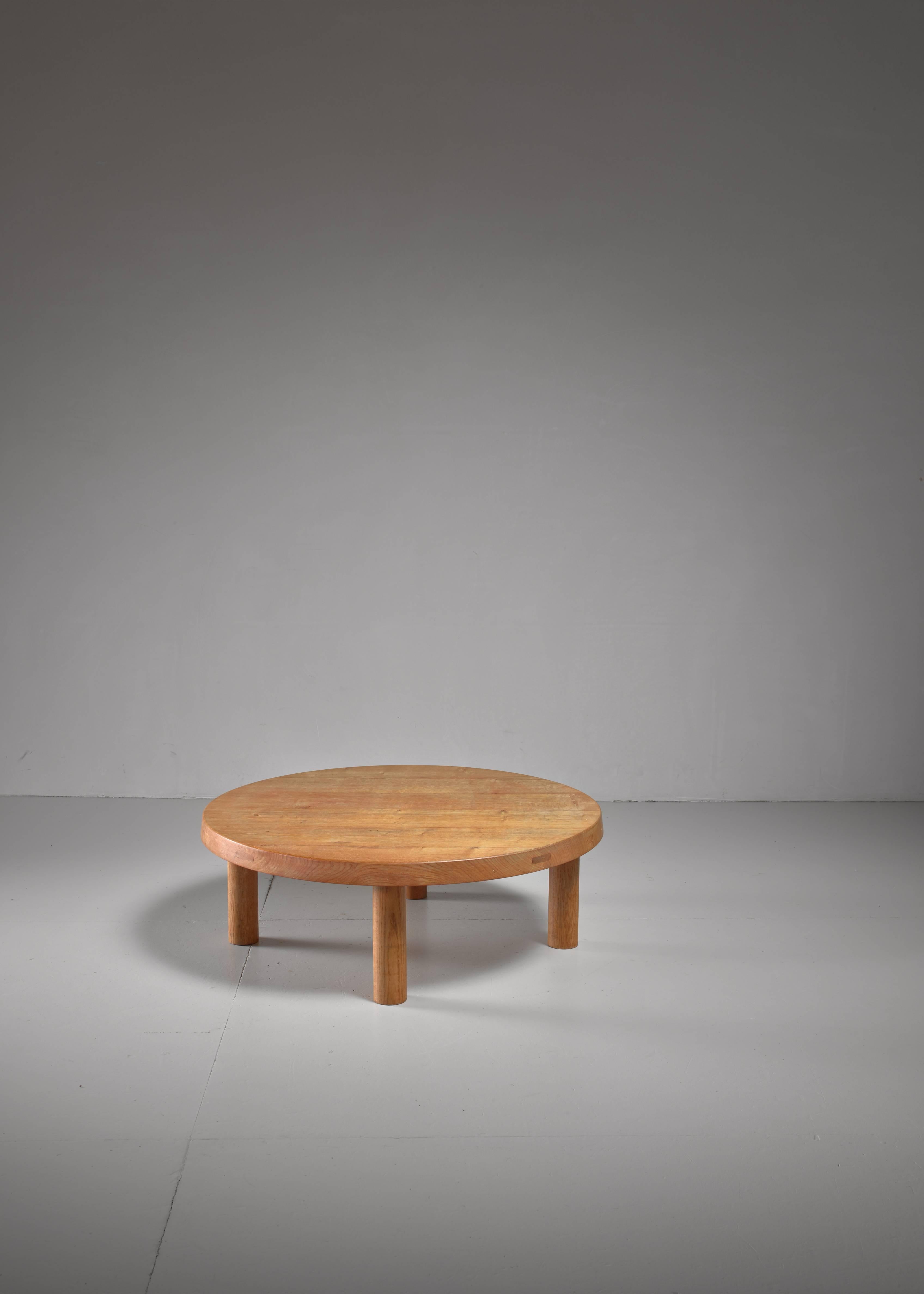 A large (94 cm diameter) coffee table by Pierre Chapo in solid oak. The table has a 5 cm thick top and is in perfect condition with beautiful markings in the wood itself.
 