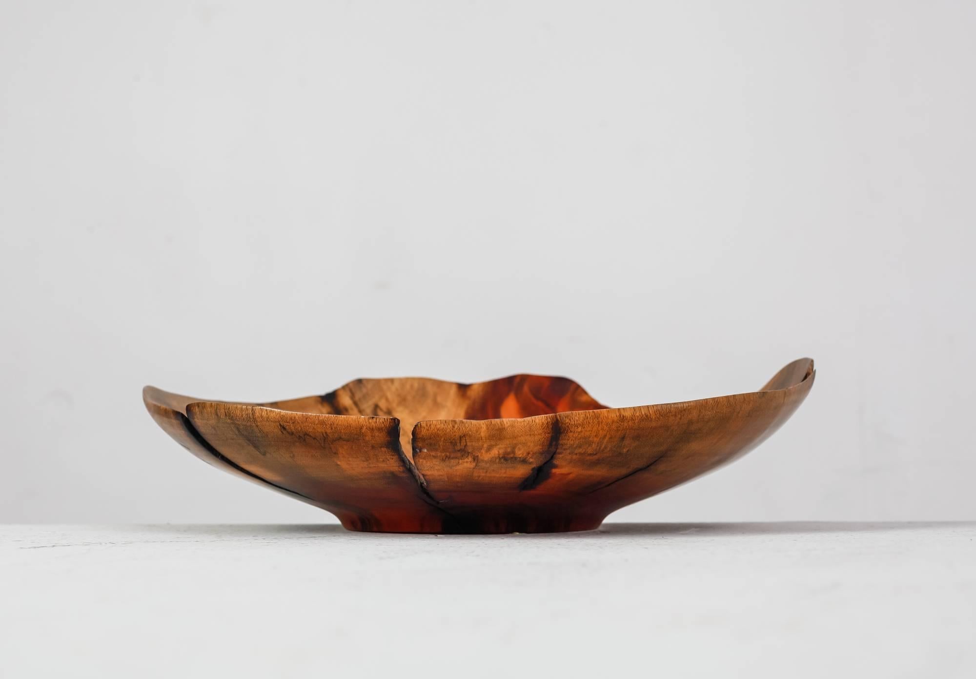 A beautifully turned bowl made of burl wood from a fallen Ron Ron tree. This piece was made by Costa Rican woodworker Arturo Solano.
Signed by Solano and in a good condition.