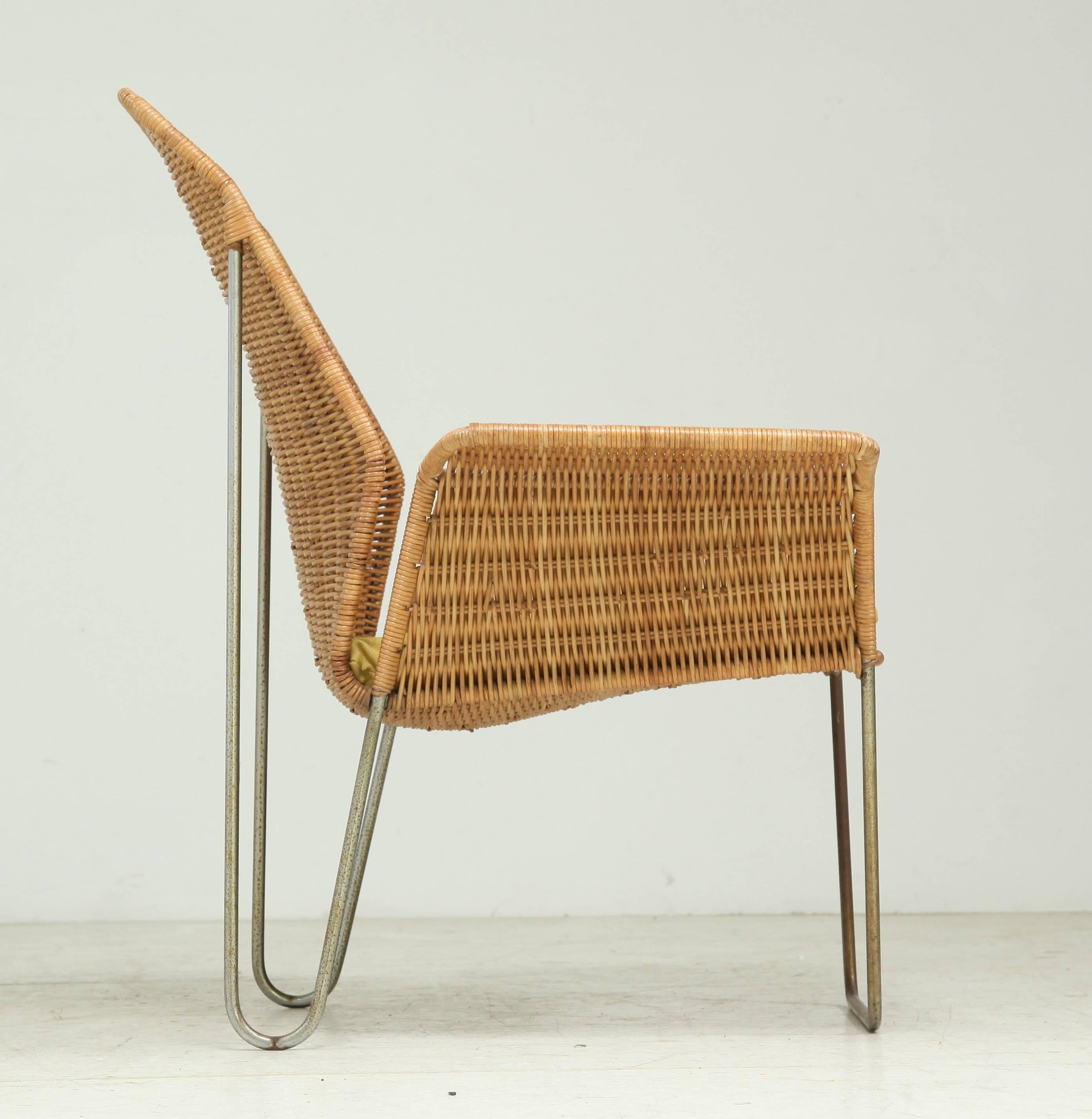 Mid-Century Modern Dutch Design rattan armchair on a bent iron frame, 1960s For Sale