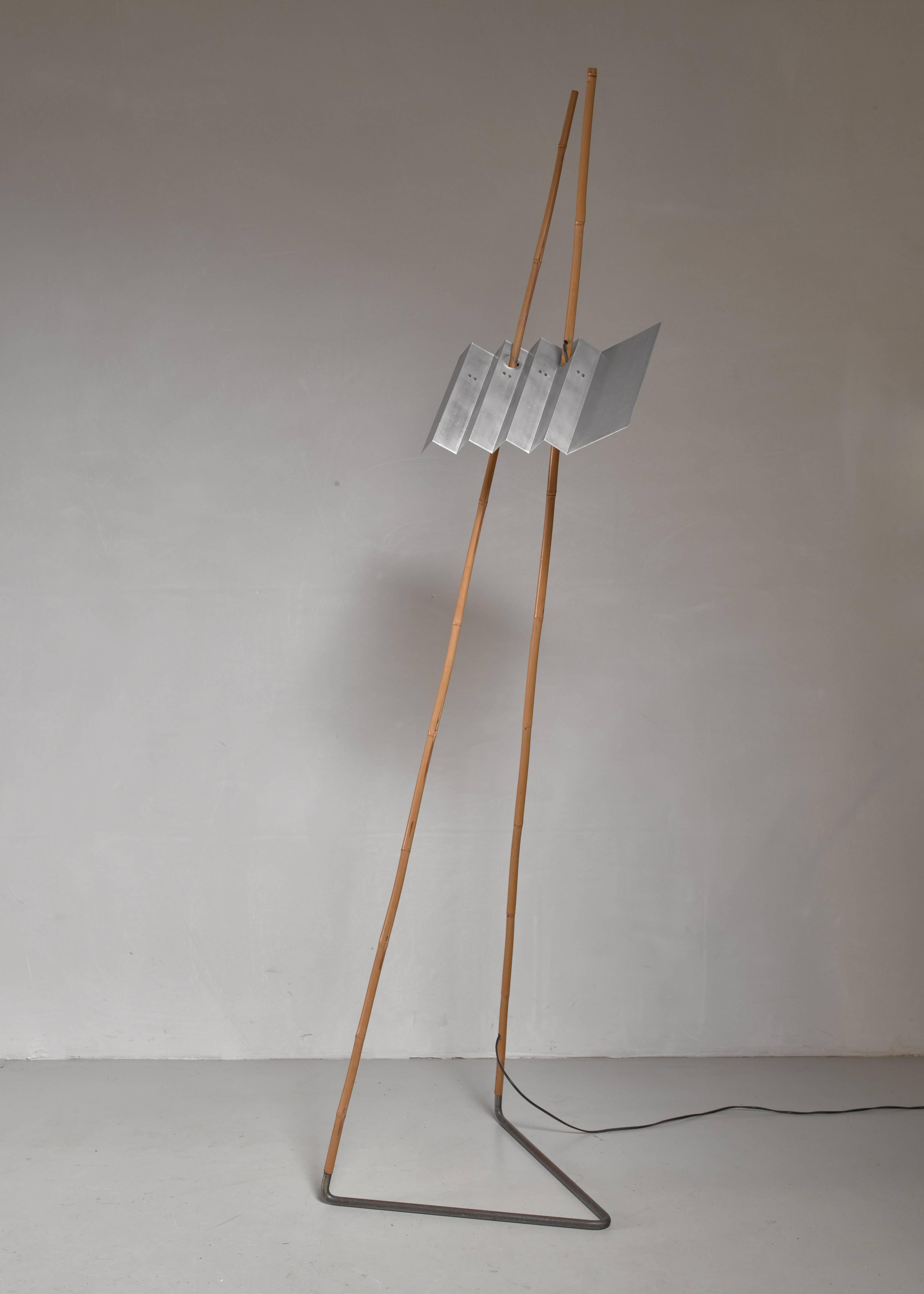 A very rare floor lamp by Dutch interior designer Anke Kamerman, with four-light bulbs under an aluminium shade. The shape of this lamp, called 'Bamboo', was inspired by a fishing rod. She designed this lamp for her own house, which had high