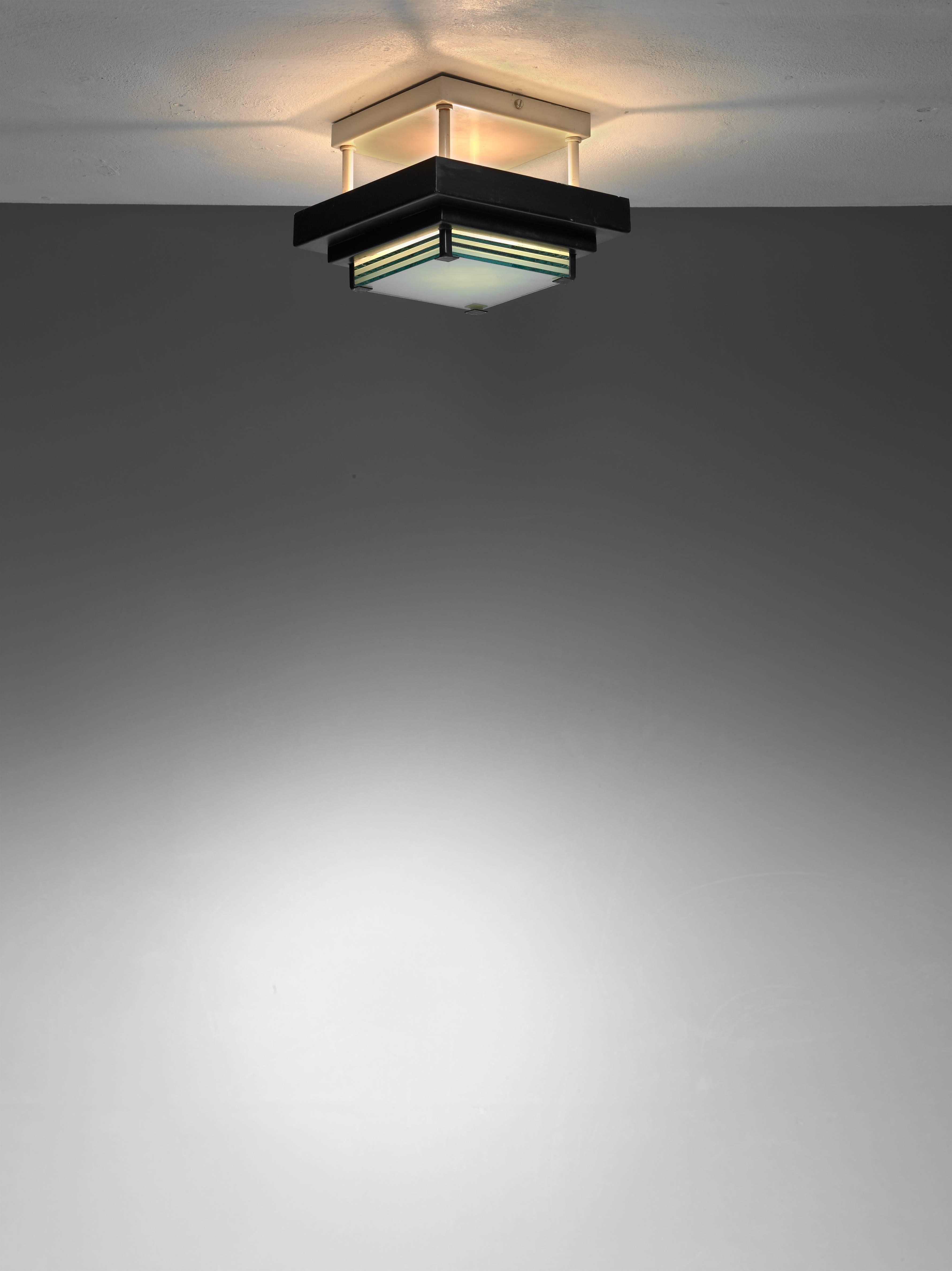 A French midcentury flush mount ceiling lamp. The lamp is made of a black and white metal frame, holding six blueish glass plates that diffuse the light.

A very simple and modernist design in the manner of Arlus and Jean Perzel.