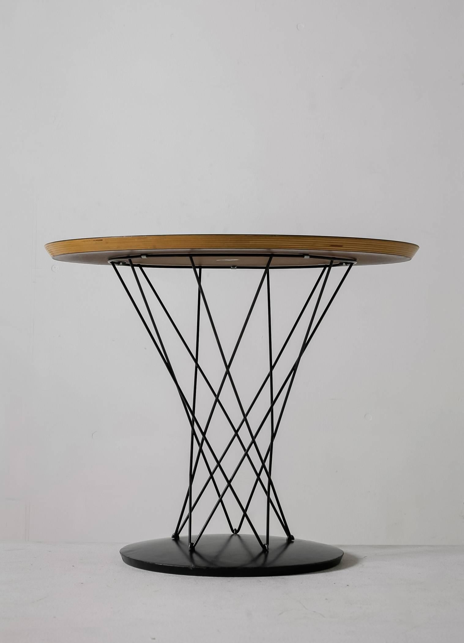 An Isamu Noguchi 'Cyclone' side or coffee table, designed in the 1950s for Knoll. The table stands on a metal plate with an iron wire base and has a white laminate top.

This piece is labeled by Knoll International and in a very good condition.