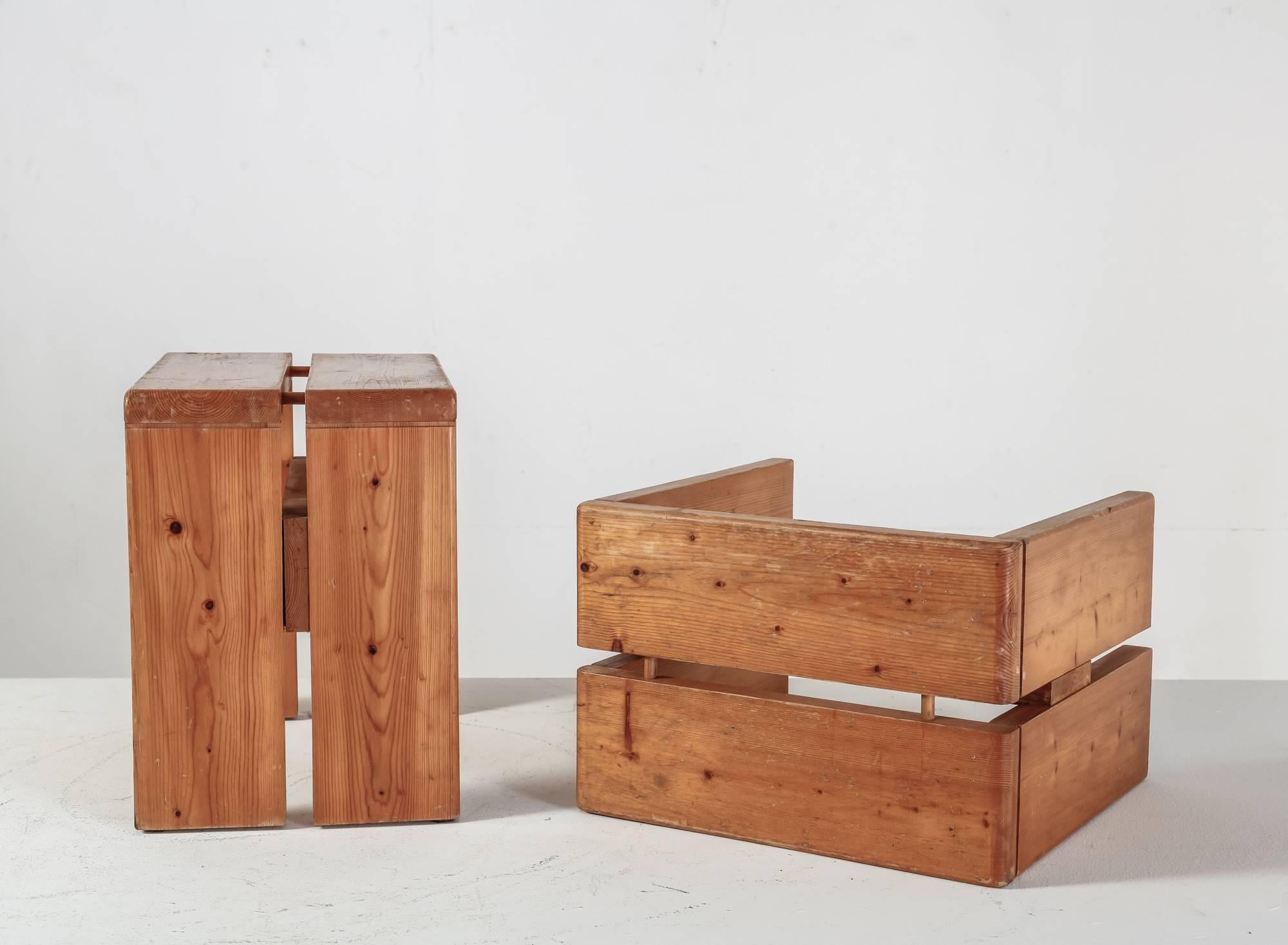 A pair of Charlotte Perriand rectangular stools made of pine. These stools were designed for the Arc 1600 ski resort in Les Arcs (1967-1969), built by a team of architects, including Perriand.

These stools show Perriand's sturdy Campagne style