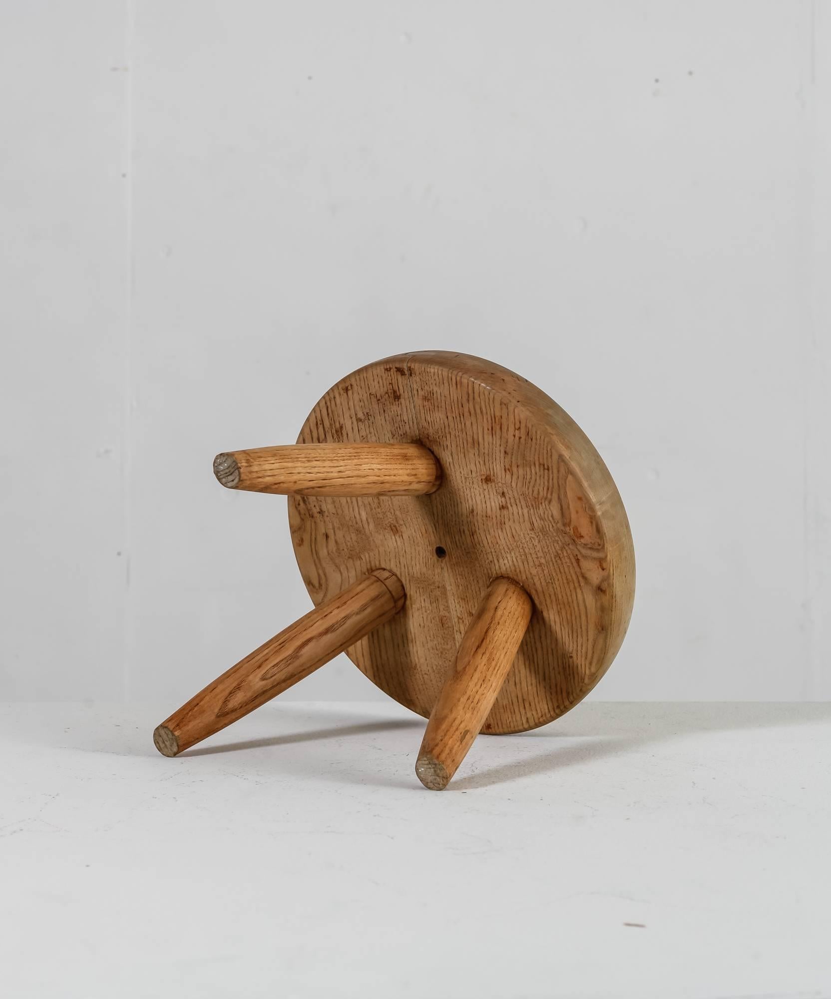 French Charlotte Perriand Oak Low Tripod Stool, France, 1950s For Sale