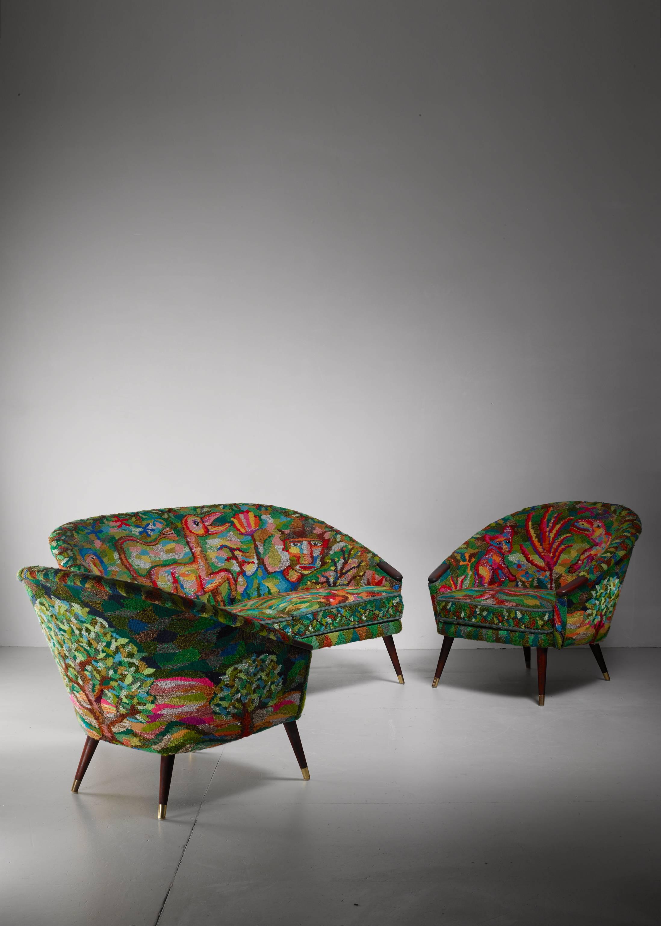 A set of a 1950s Swedish sofa and two lounge chairs, by Ragnar Helsén for AB Stjernmöbler. The upholstery is what makes this set unique. It is handwoven by textile artist Siri Søger in 1986 and shows animals and plants and is especially designed