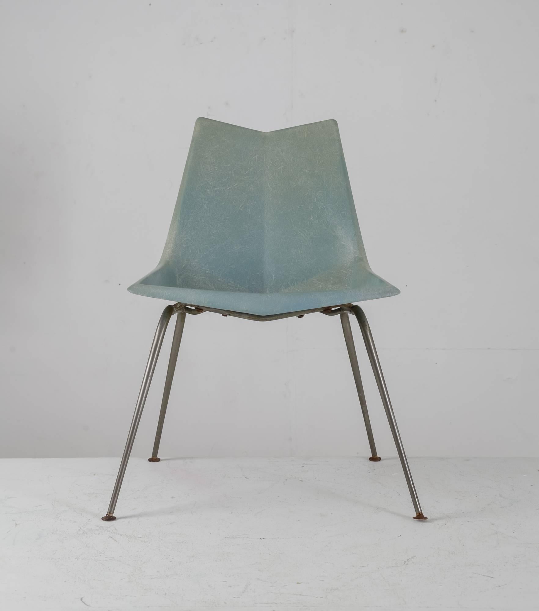A 1950s light blue-grey Paul McCobb Origami chair for St. John Seating. The fiberglass seat is molded at angles, reminiscent of the Japanese origami technique. The chair stands on tubular iron legs. 
Labeled and in a good and original condition.
  