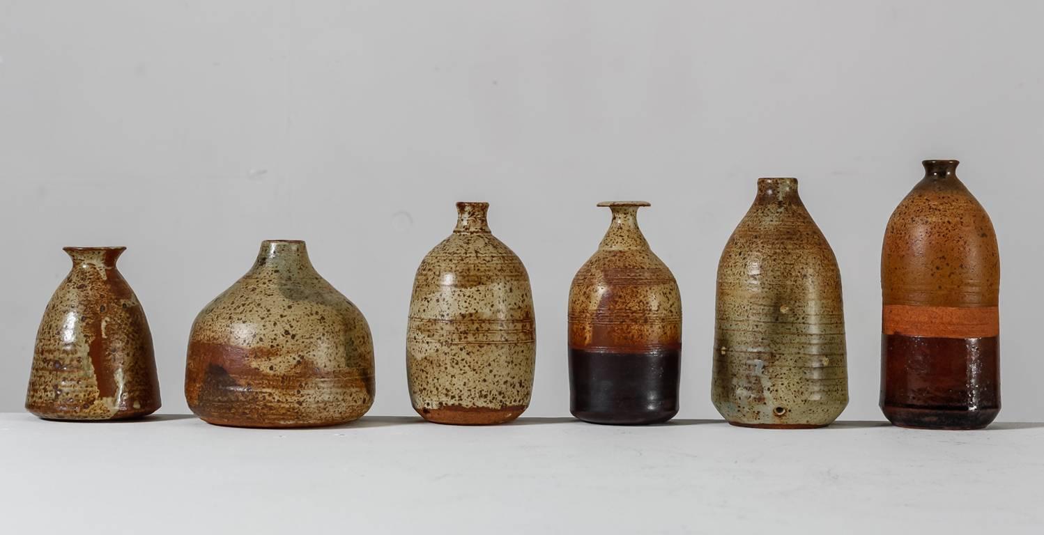A collection of six vases by French ceramist Franco Agnese.
The vases have an earth tone finish and are all marked by Agnese and in a great, never used, condition.

The smallest piece of this collection has a diameter of 10 cm (4