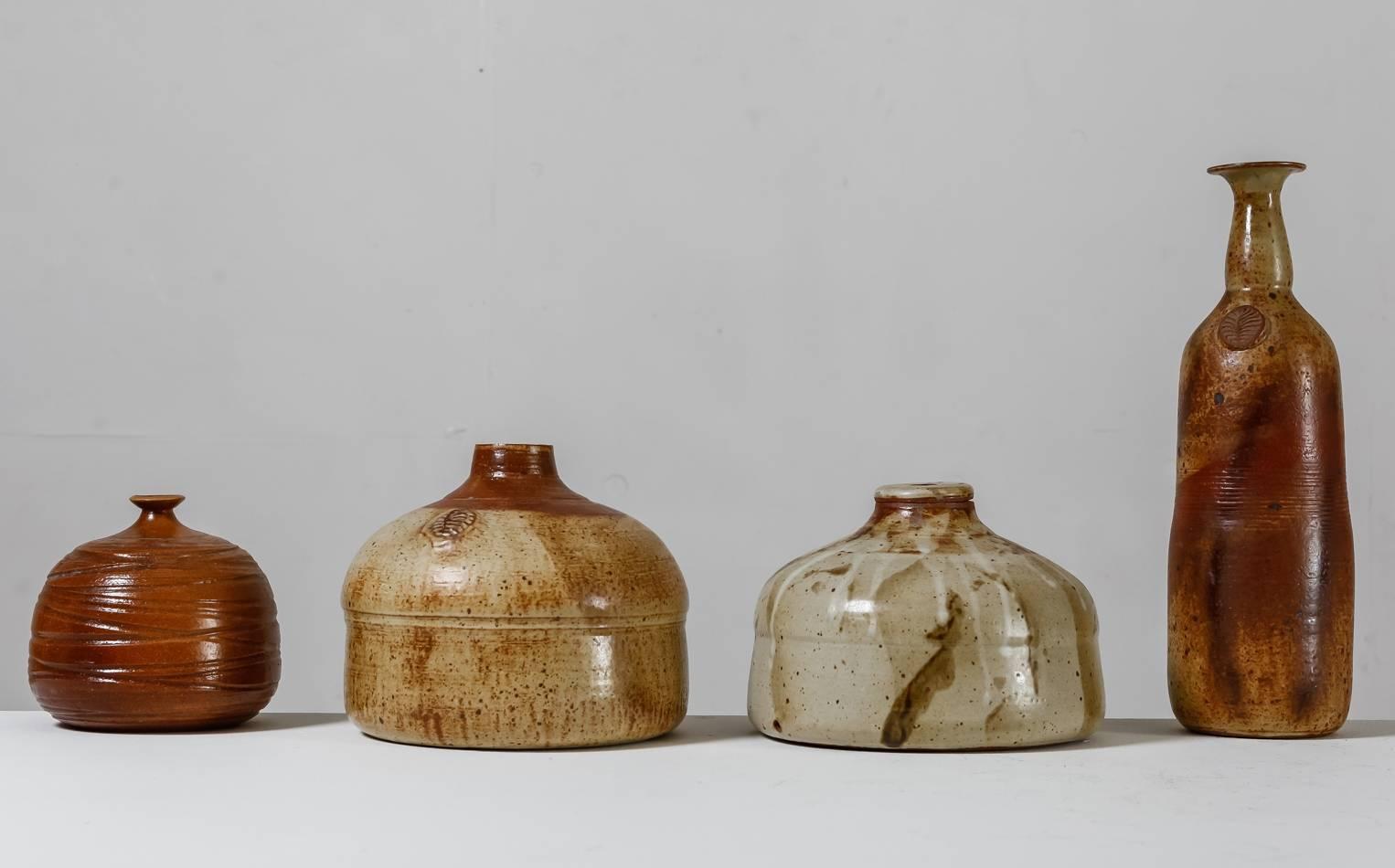 A collection of four vases by French ceramist Franco Agnese.
The vases have an earth tone finish and are all marked by Agnese and in a great, never used, condition.

The smallest piece of this collection has a diameter of 17 cm (6.7