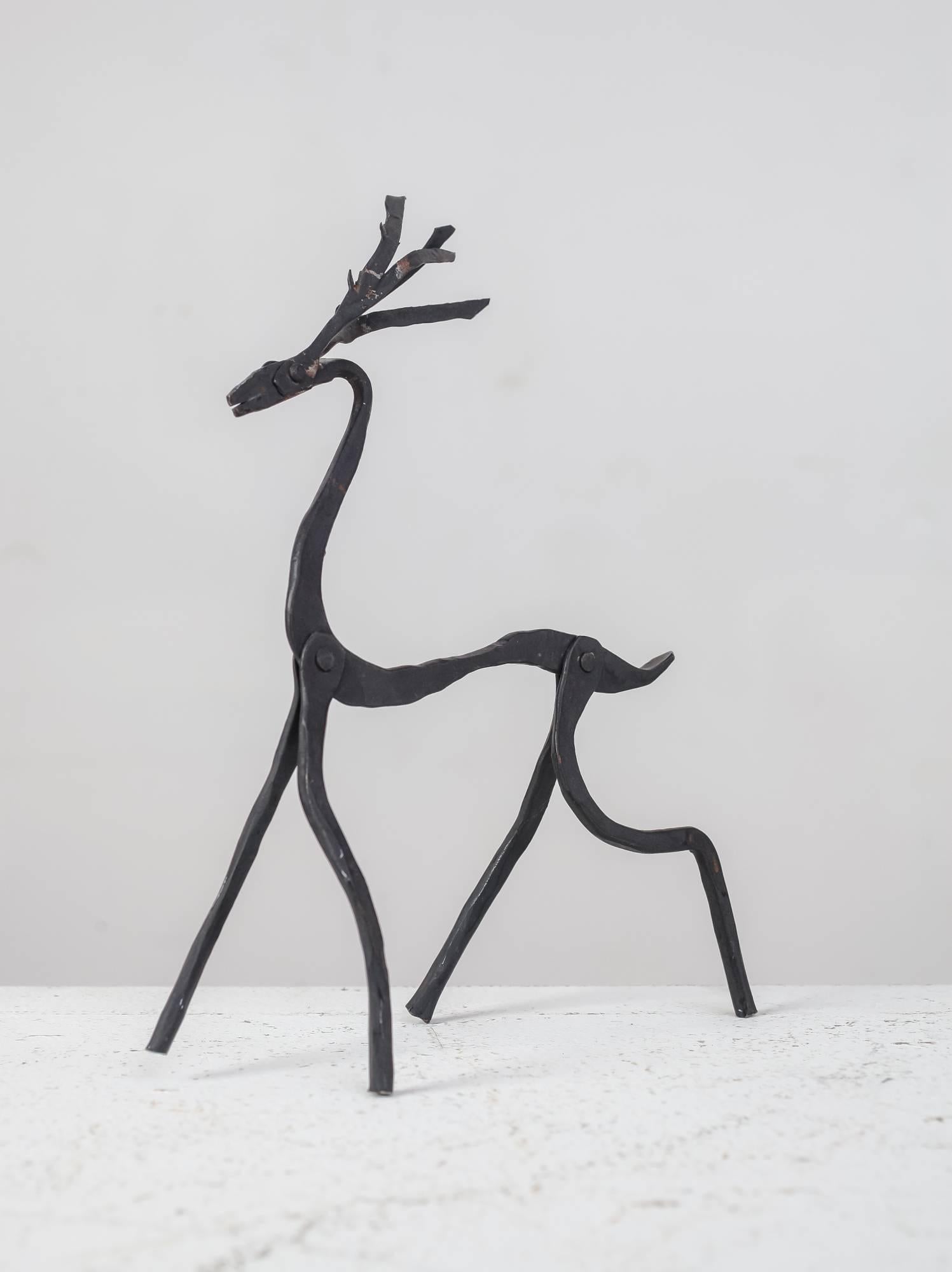 A small iron deer sculpture with movable parts, by Jean Touret for Atelier Marolles.

This piece was part of a large estate of Touret items, bought directly from the sons of the owners. The Atelier Marolles was commissioned to furnish the house,
